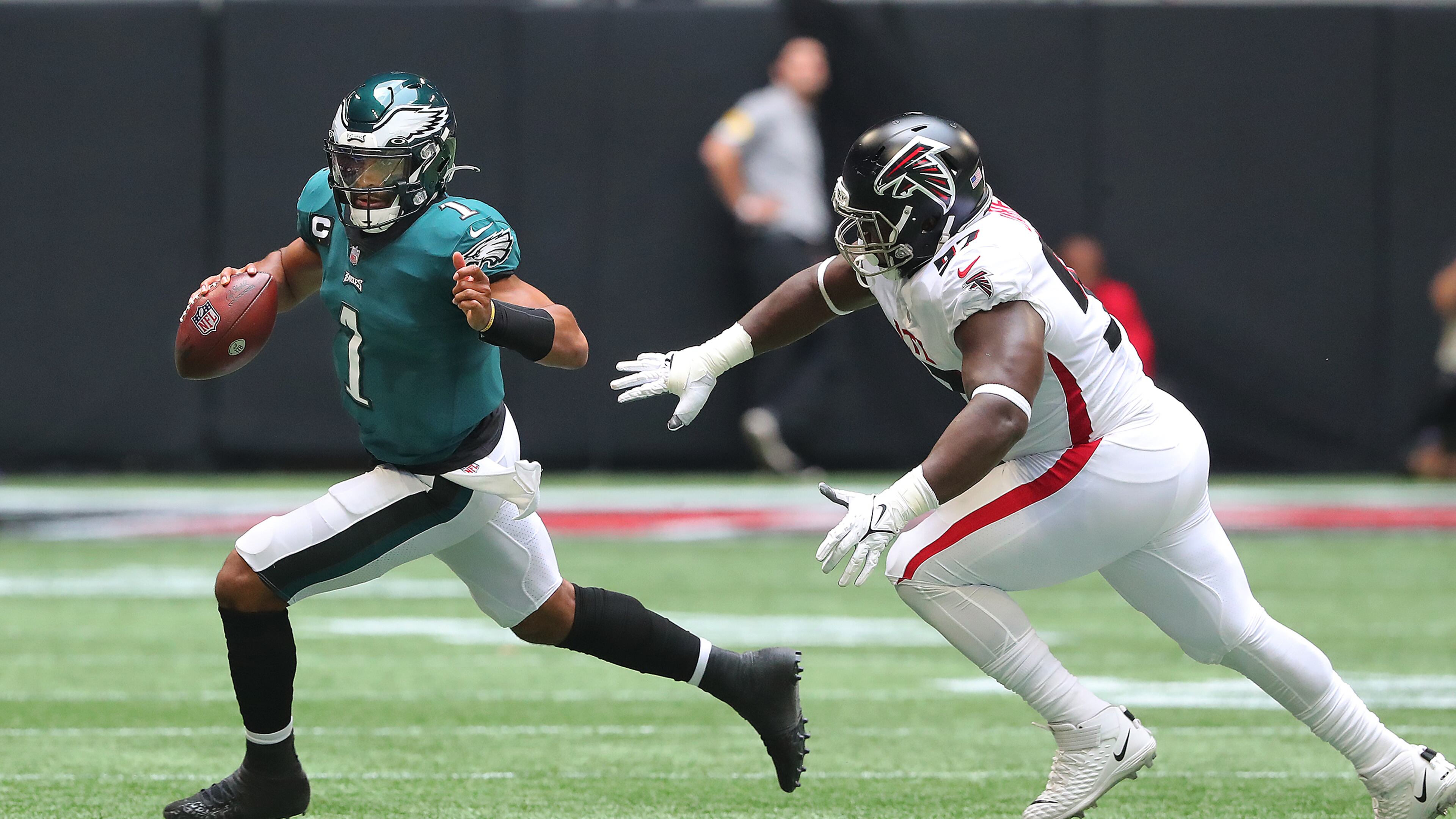 Falcons defensive lineman Grady Jarrett runs Philadelphia Eagles quarterback Jalen Hurts out of bounds on a 4th-and-4 attempt to turn it over on downs during the second quarter Sunday, Sept. 12, 2021, at Mercedes-Benz Stadium in Atlanta. (Curtis Compton / Curtis.Compton@ajc.com)