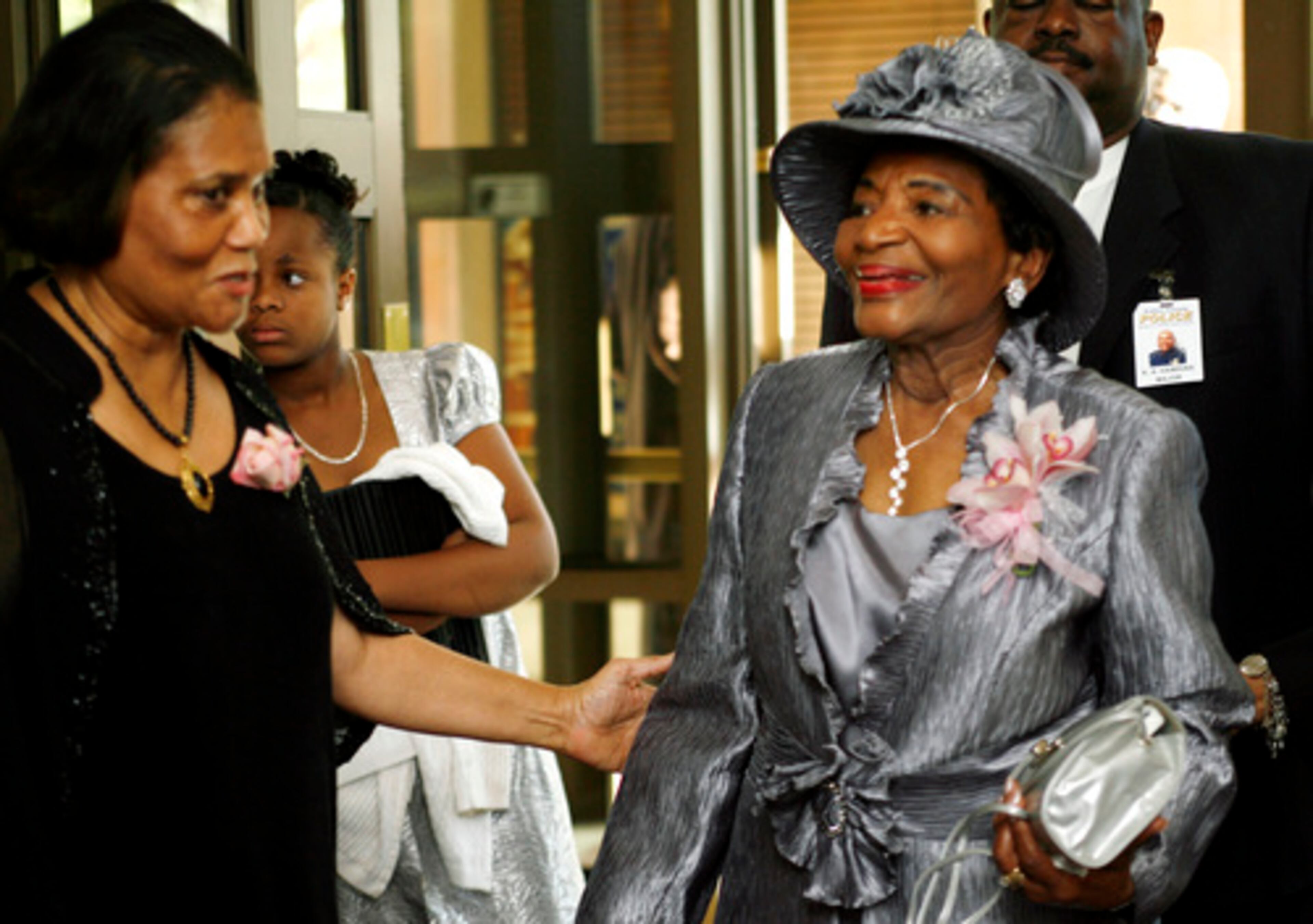 Sylvia Cook (left) greets Dr. Christine King Farris as she arrives at Ebenezer Baptist Church for her 80th birthday celebration Sunday.