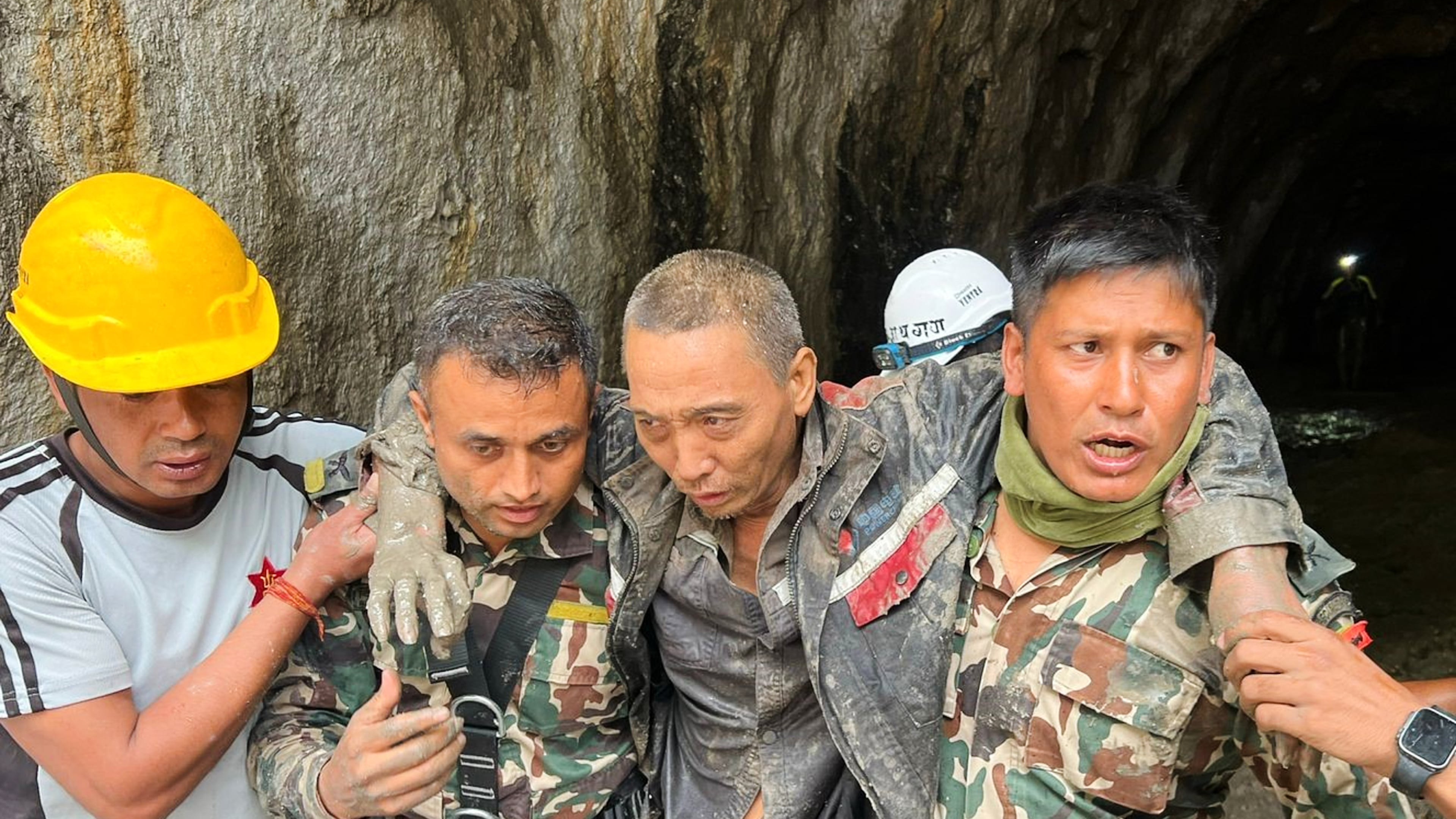 In this photo provided by the Nepal Army, a Chinese national is seen after being rescued by soldiers during an ongoing operation at the Trishuli-3A hydropower project in Nepal's Rasuwa district, Saturday, Sept. 5, 2026. (Nepal Army via AP)