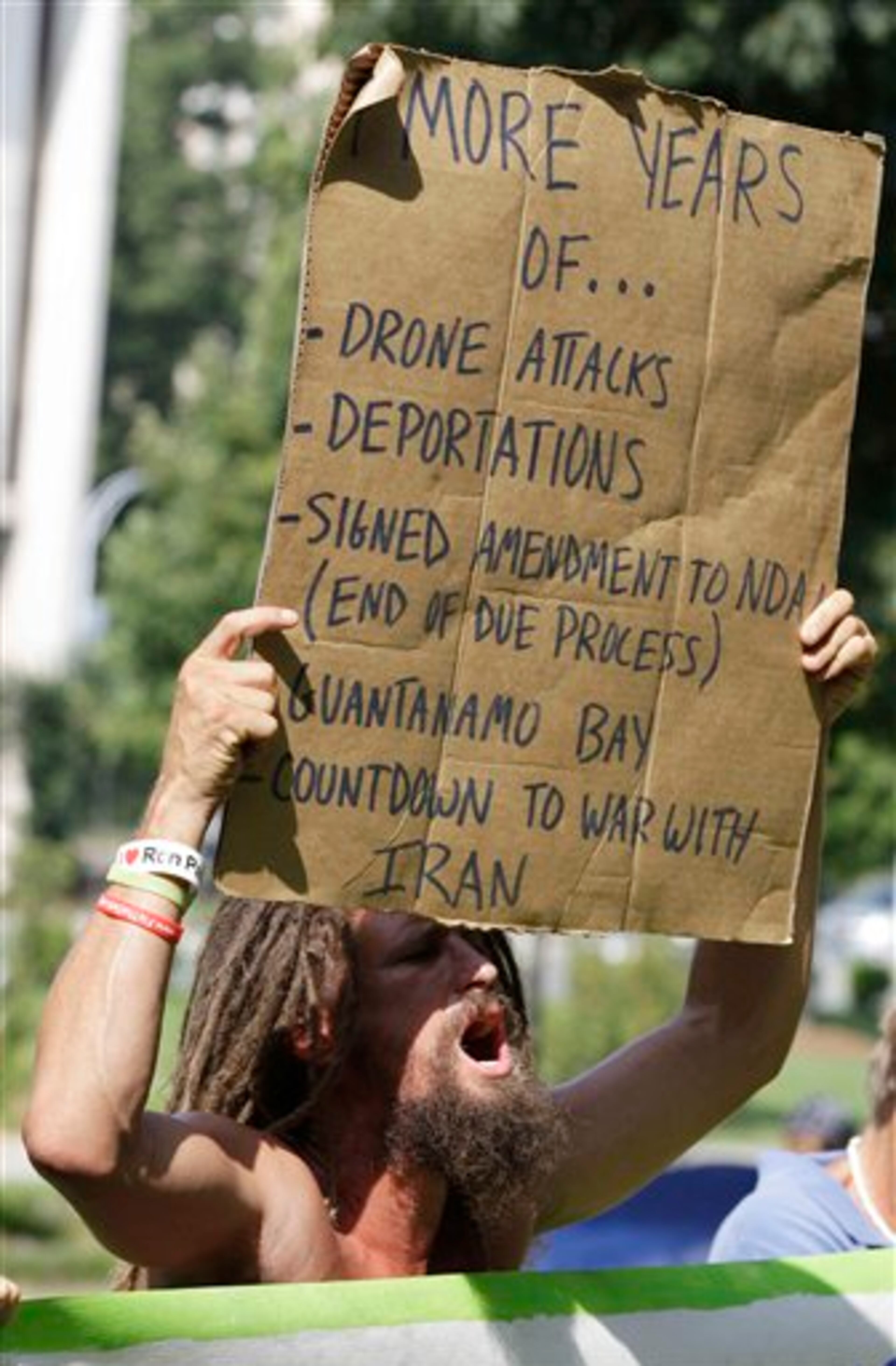 A demonstrator chants during a protest march, Monday, Sept. 3, 2012, in Charlotte, N.C. Demonstrators are protesting before the start of the Democratic National Convention. (AP Photo/Chuck Burton)