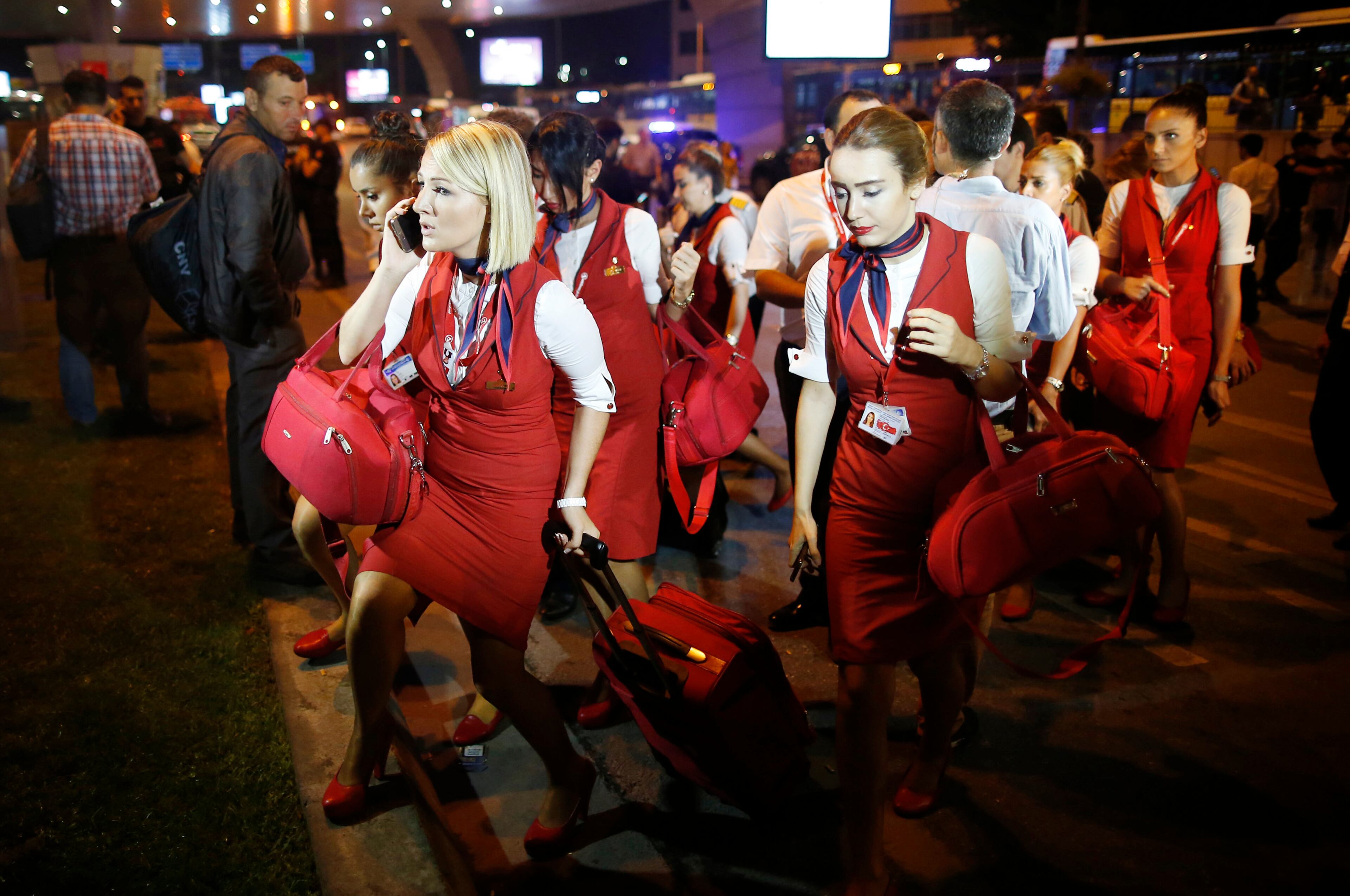 Members of a flight crew leave Istanbul's Ataturk airport, early Wednesday, June 29, 2016. Suspected Islamic State group extremists have hit the international terminal of Istanbul's Ataturk airport, killing dozens of people and wounding many others, Turkish officials said Tuesday. Turkish authorities have banned distribution of images relating to the Ataturk airport attack within Turkey. (AP Photo/Emrah Gurel)