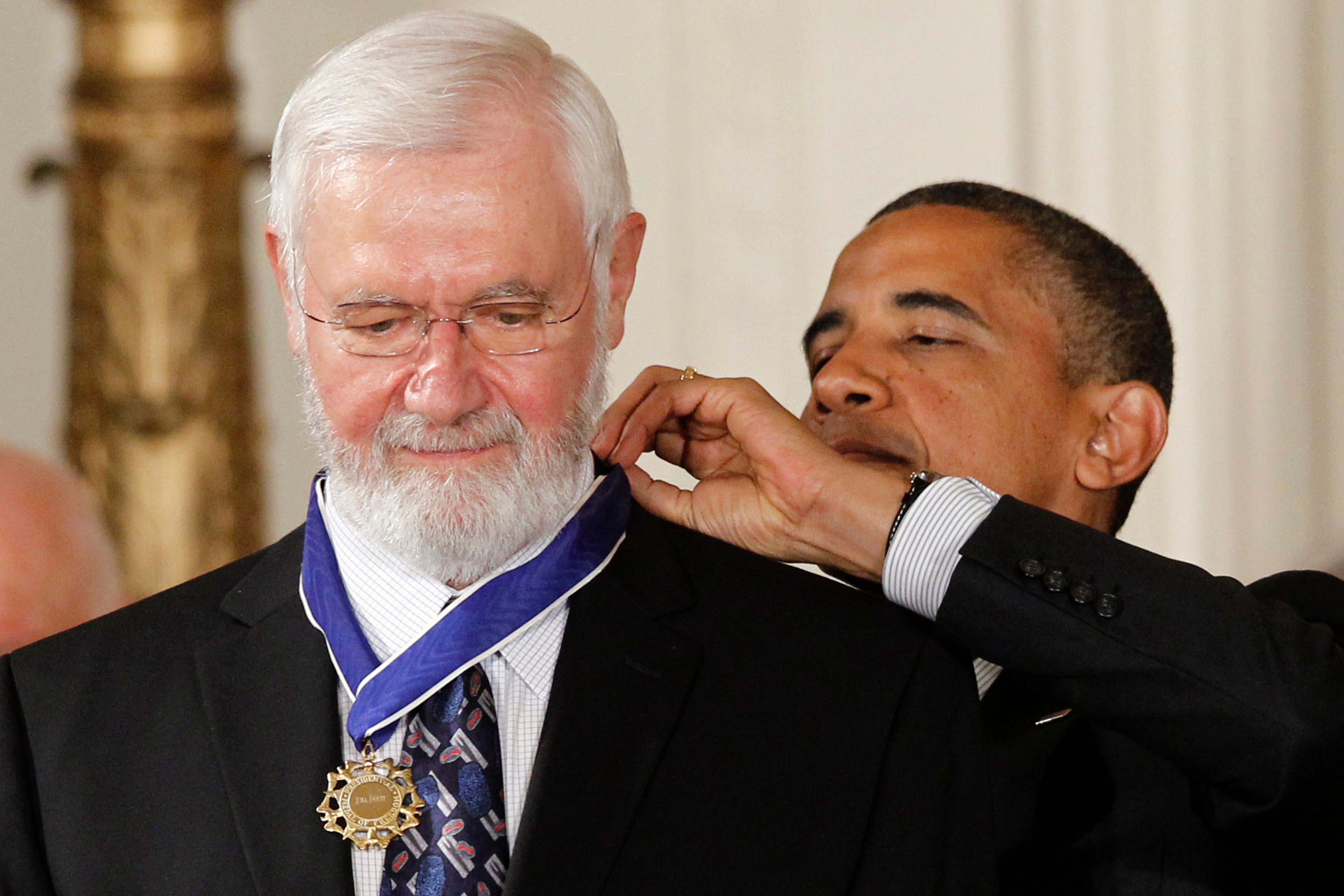 President Barack Obama (back) awards the Medal of Freedom to Dr. William Foege, former director of the Centers for Disease Control and Prevention, during a 2012 ceremony in the White House in Washington. Foege helped lead the effort to eradicate smallpox. (Charles Dharapak/AP 2012)