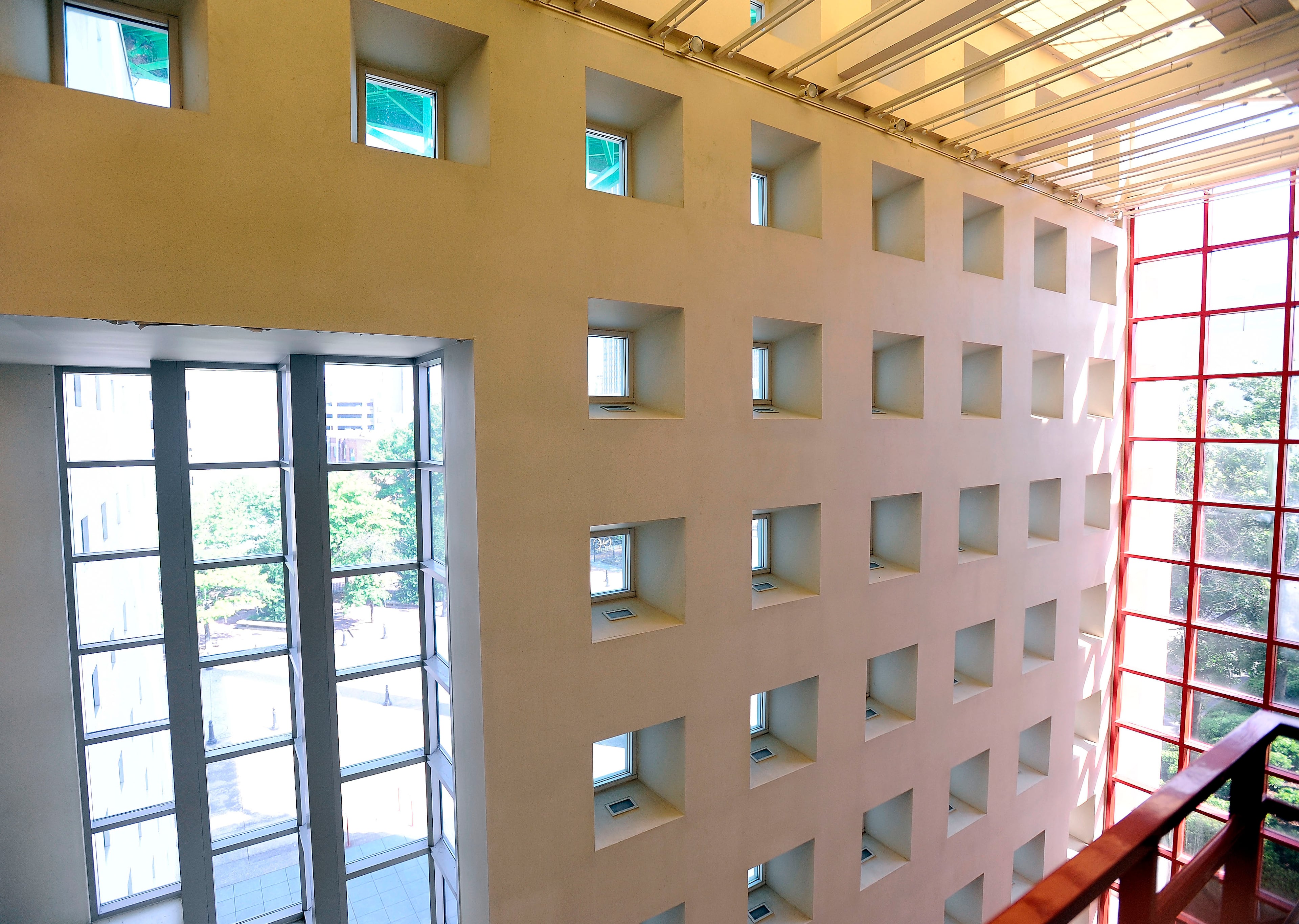 Distinctive white and red windows at the former World of Coca-Cola building next to Underground Atlanta mark the building after the soft drink company moved its museum to Centennial Park six years ago. The facility, currently managed by the State Building Authority, is shown on Friday, June 28, 2013, in Atlanta. David Tulis / AJC Special