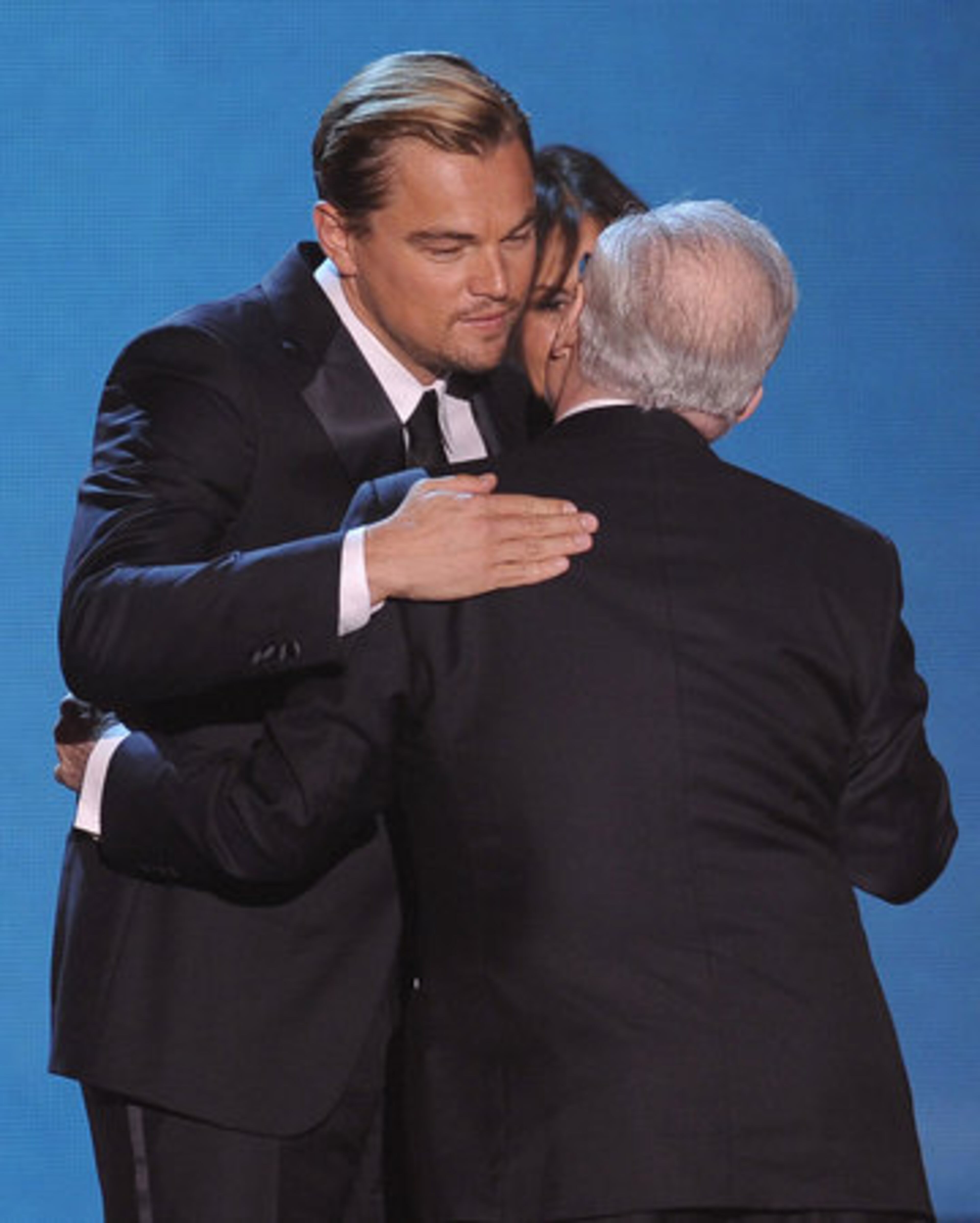 From left, Leonardo DiCaprio, Olivia Harrison and Martin Scorsese are seen onstage as Scorsese accepts the music and film award.