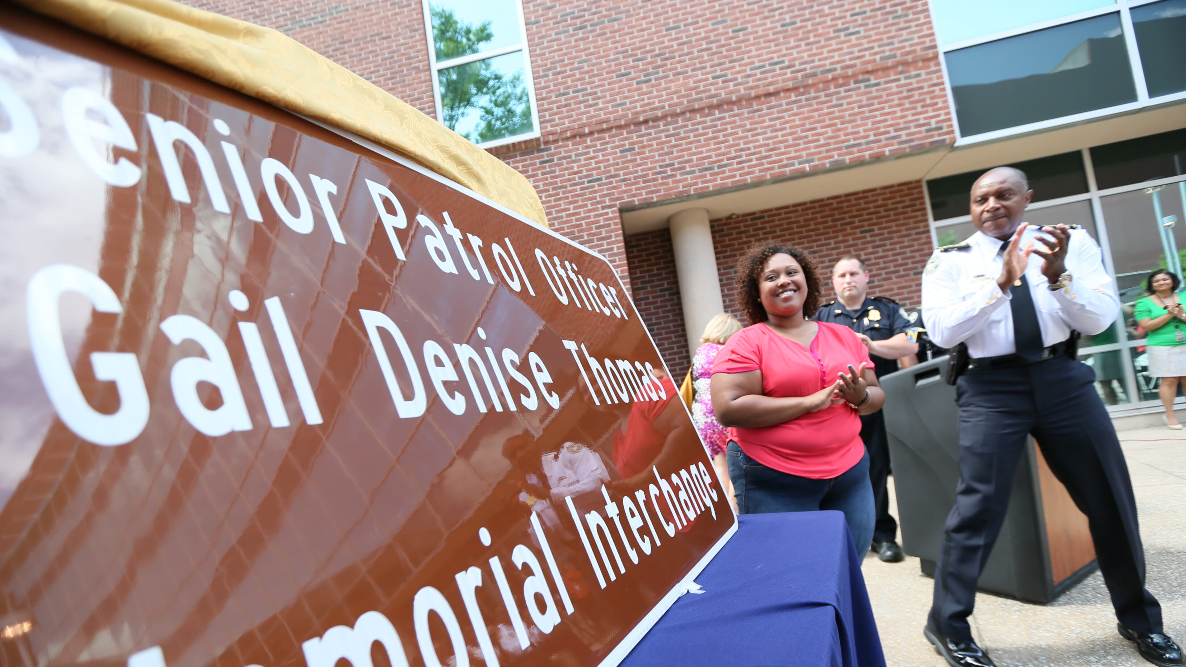 The Atlanta Police Department unveiled a memorial sign at its headquarters Thursday dedicated to an officer killed in the line of duty last January.