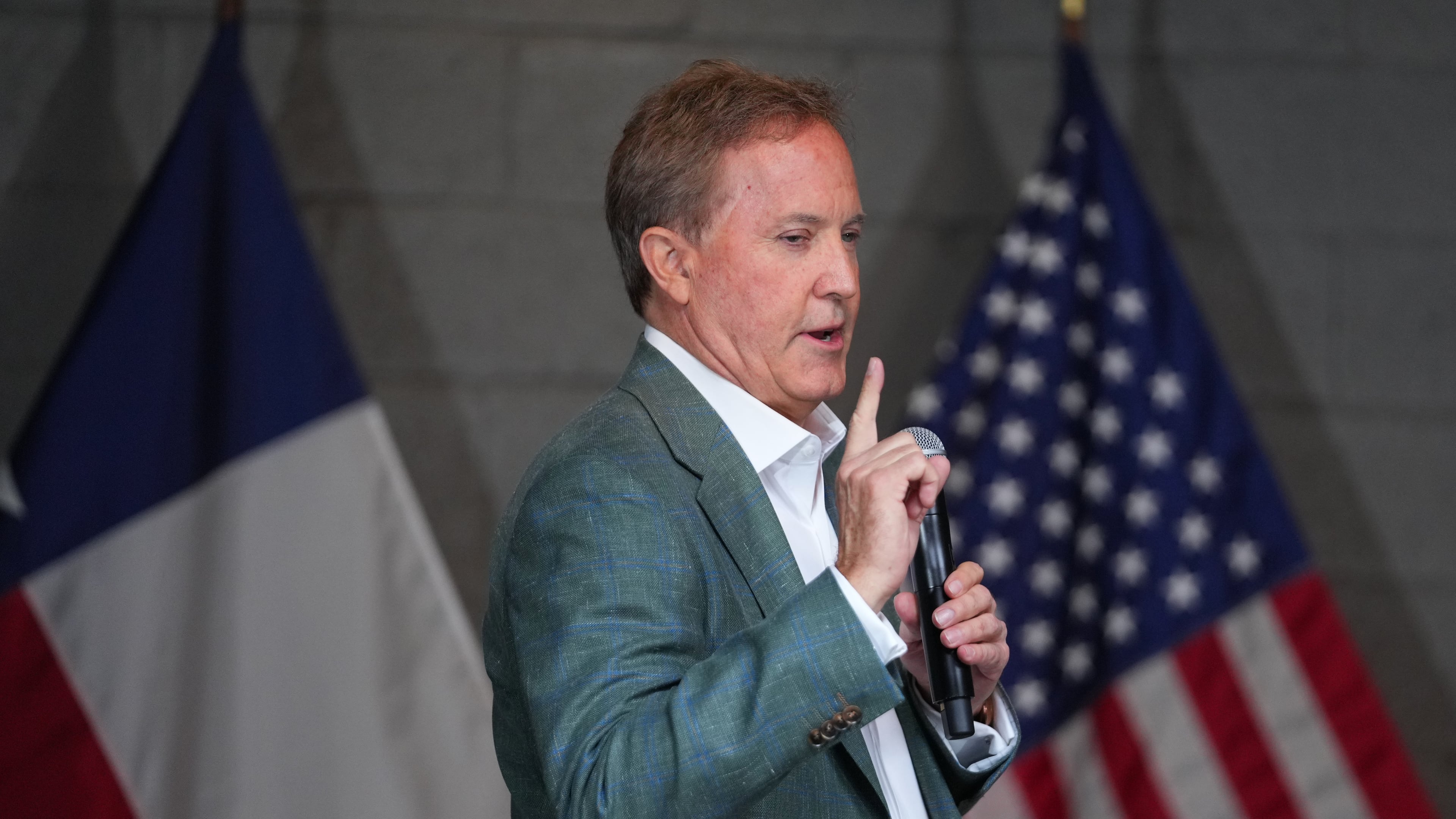 Texas Attorney General Ken Paxton, a Republican candidate for the U.S. Senate, speaks to supporters while campaigning for his primary runoff race Monday, May 18, 2026, in Dallas. (AP Photo/Julio Cortez)