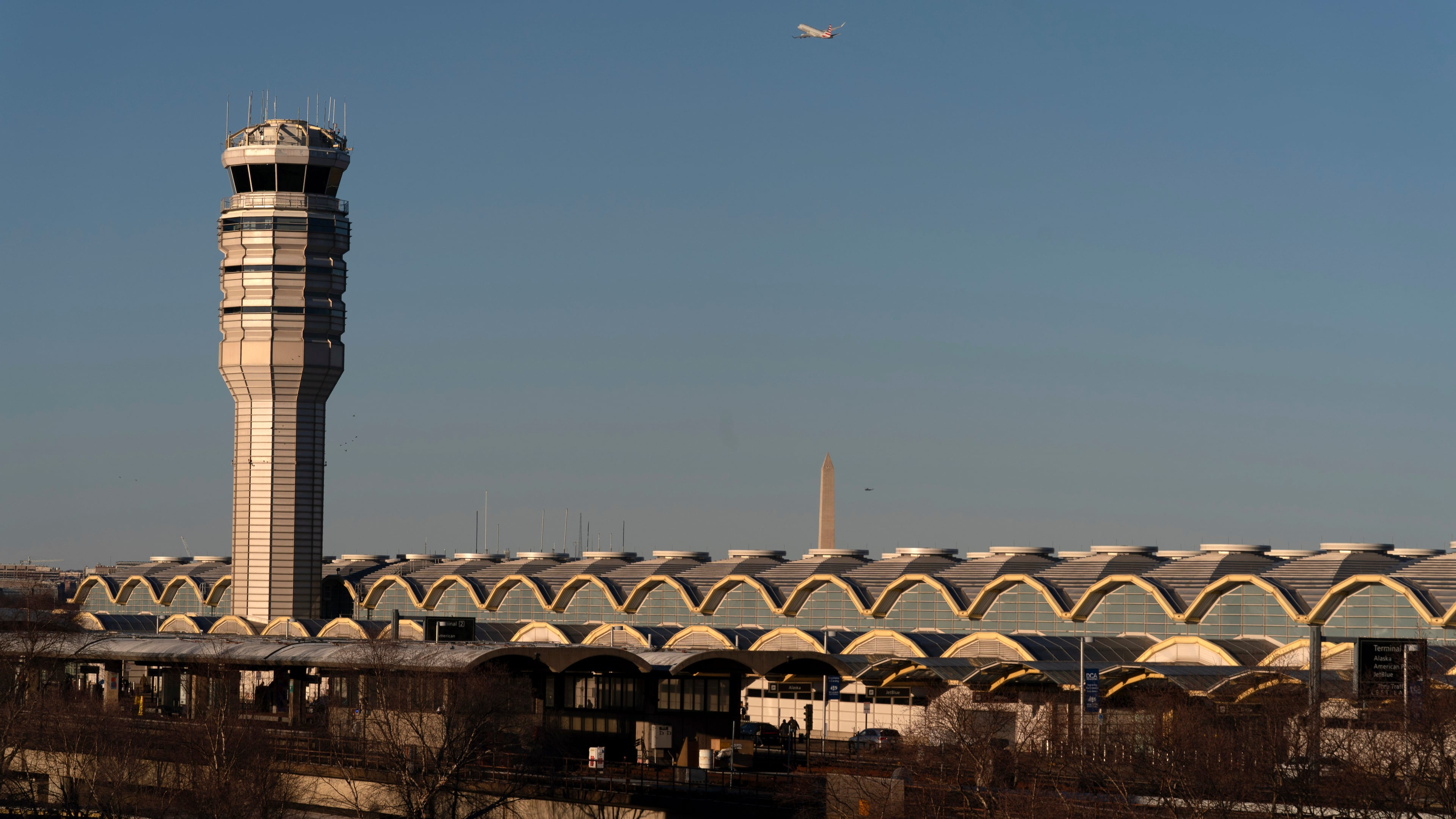 FILE - The air traffic control tower at Ronald Reagan Washington National Airport is seen, Feb. 1, 2025, in Arlington, Va., near the wreckage of a mid-air collision between a Black Hawk helicopter and an American Airlines jet in the Potomac River. (AP Photo/Jose Luis Magana, File)