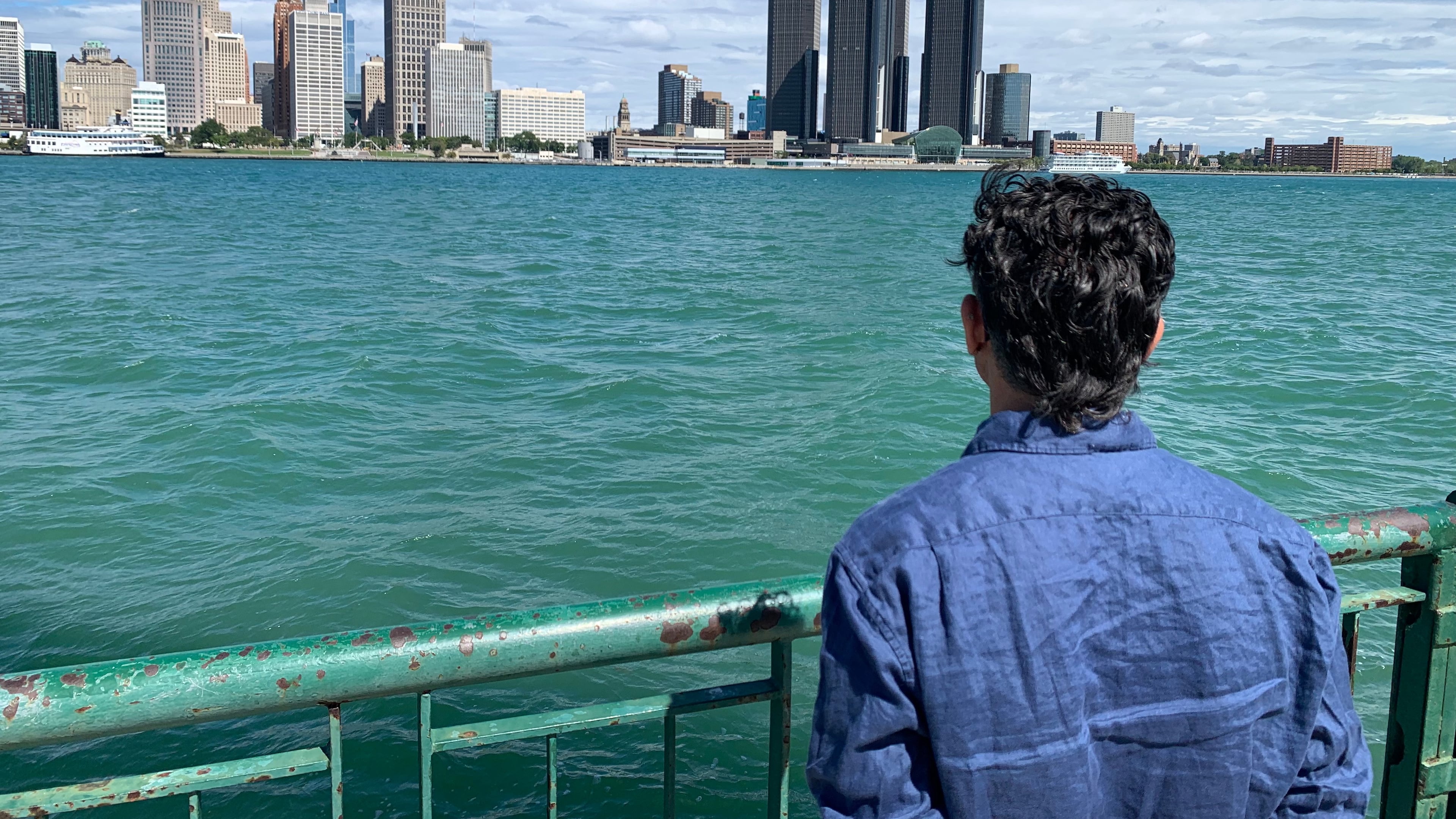 City Councillor Renaldo Agostino looks at the Detroit skyline across the Detroit River Monday, Aug. 24, 2026, in Windsor, Ontario (AP Photo/Mike Householder)