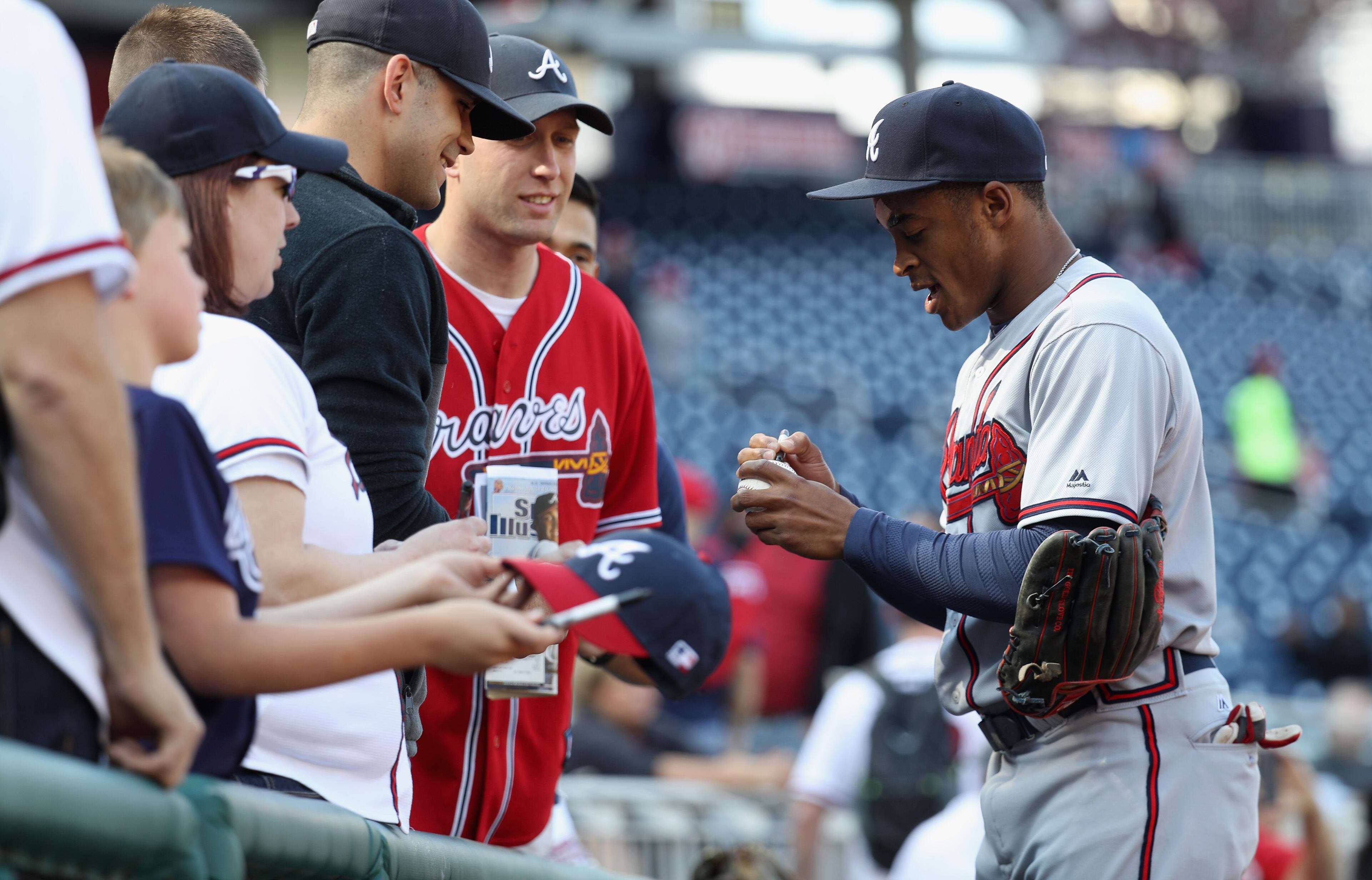 Mallex Smith #17 of the Atlanta Braves signs autographs before the start of the Braves and Washington Nationals game at Nationals Park on April 14, 2016 in Washington, DC. (Photo by Rob Carr/Getty Images)