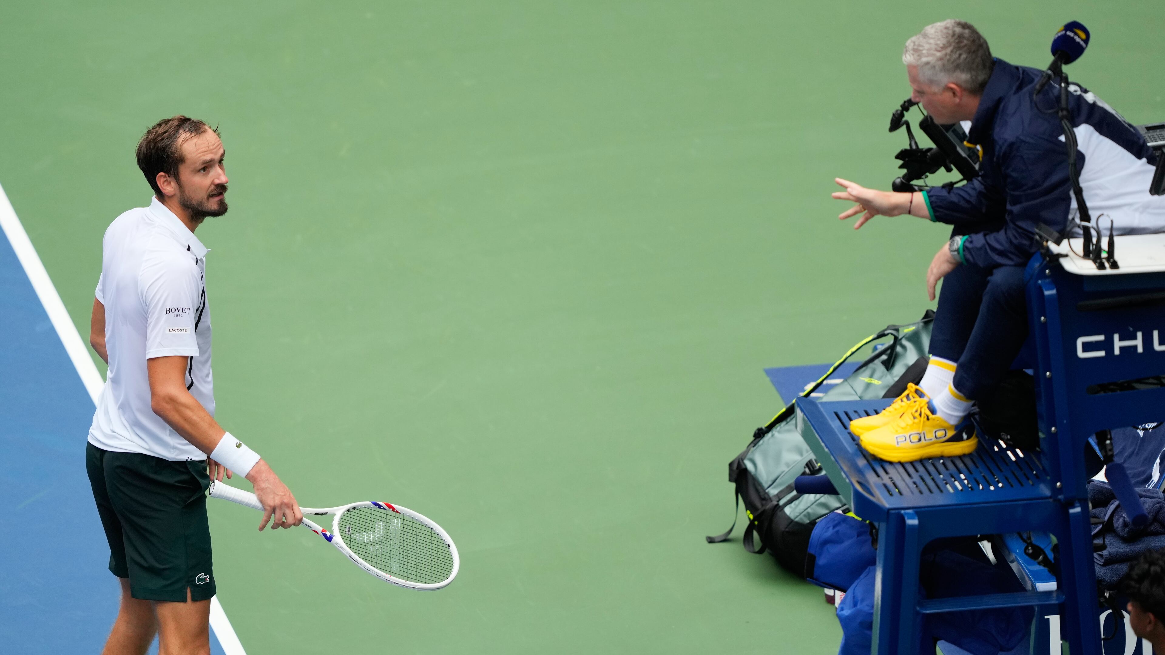 Daniil Medvedev, of Russia, left, talks with the official during the second round of the U.S. Open tennis championships against Sebastian Gorzny, of the United States, Wednesday, Sept. 2, 2026, in New York. (AP Photo/Yuki Iwamura)