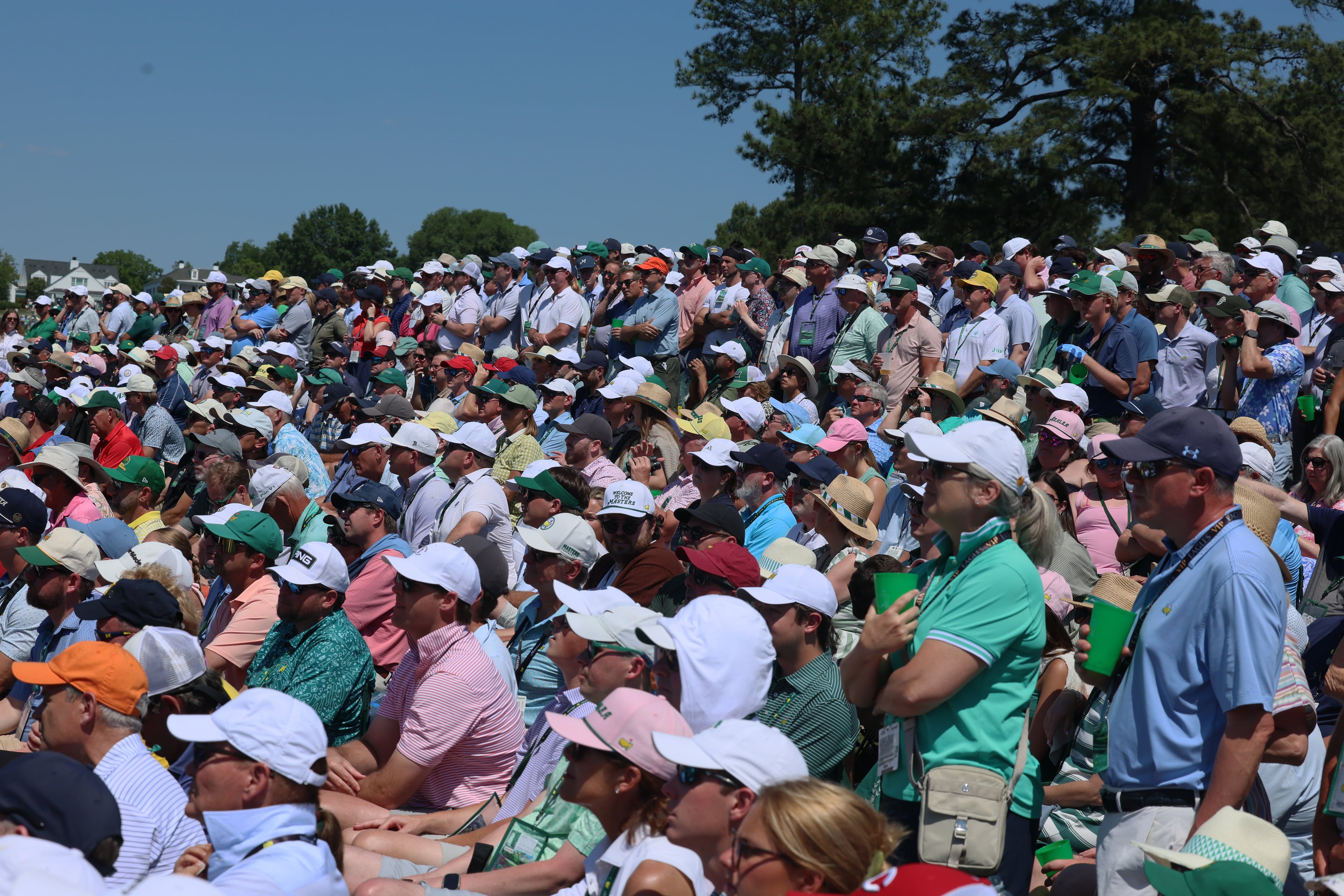 Patrons crowd hill to watch Justin Rose putt on second green during final round of the Masters, at Augusta National Golf Club, Sunday, April 12, 2026, in Augusta, GA (Jason Getz/AJC)
