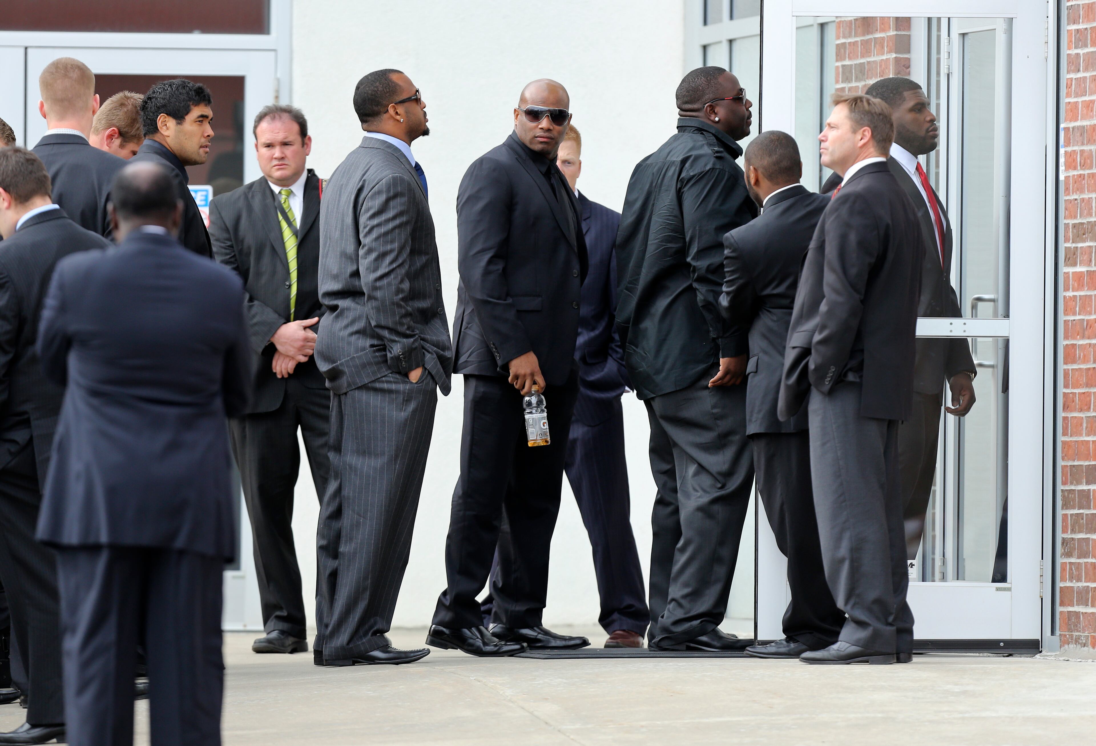 Members of the Kansas City Chiefs football team arrive at the memorial service. | Teammates attend memorial | More photos: Families grieving | Controversy over Costas’s comments