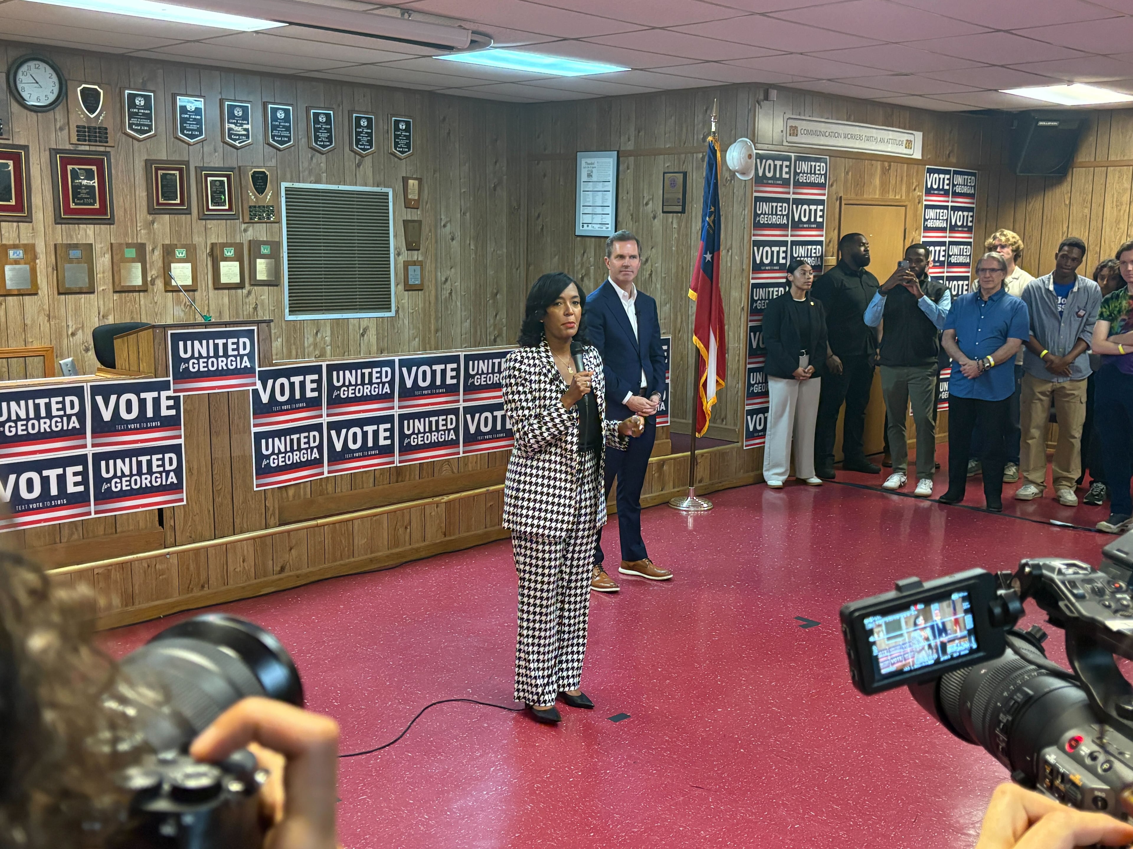 Democratic nominee for governor Keisha Lance Bottoms, left, speaks during a campaign event on Monday in Atlanta as Kentucky Gov. Andy Beshear, right, listens. (Riley Bunch/AJC)