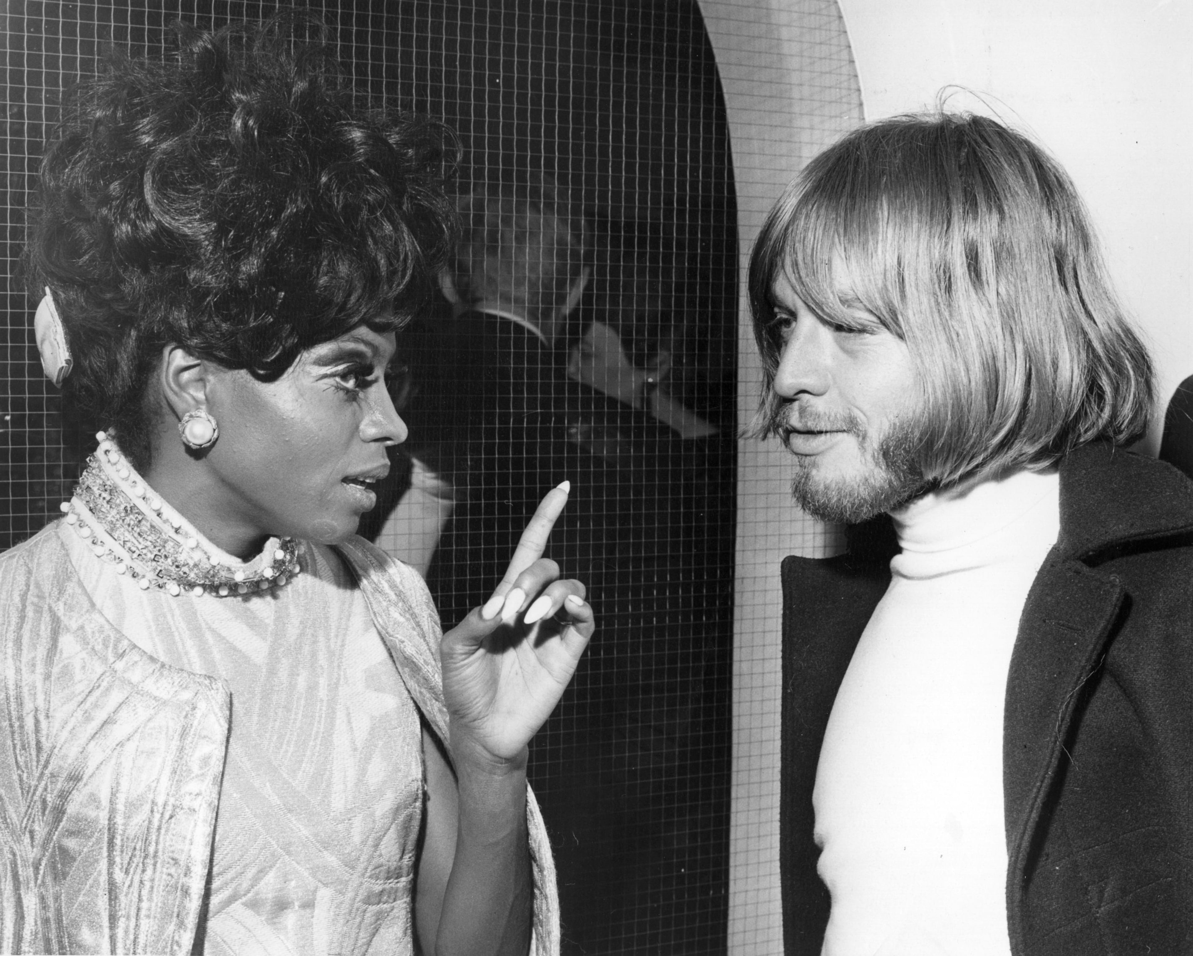 American soul singer Diana Ross talks to Rolling Stones bad boy Brian Jones during an aftershow party hosted by the Duke and Duchess of Bedford to celebrate The Supremes performance on Sunday Night At the Palladium. (Photo by Keystone/Getty Images)