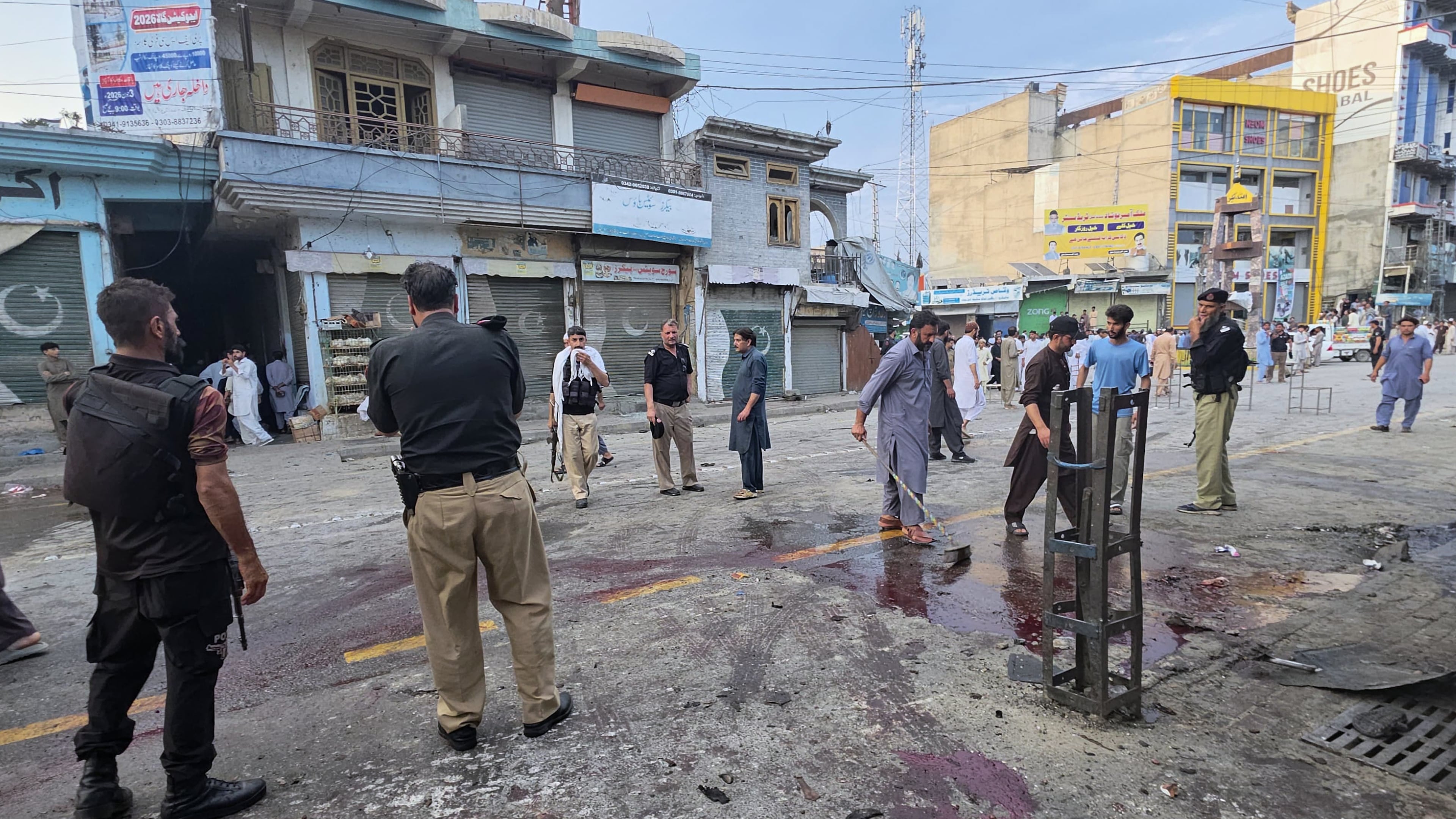 Police officers examine the site following a suicide bombing, in Kabal, a town in the Swat Valley in Pakistan's Khyber Pakhtunkhwa province, Sunday, Aug. 2, 2026. (AP Photo/Sherin Zada)