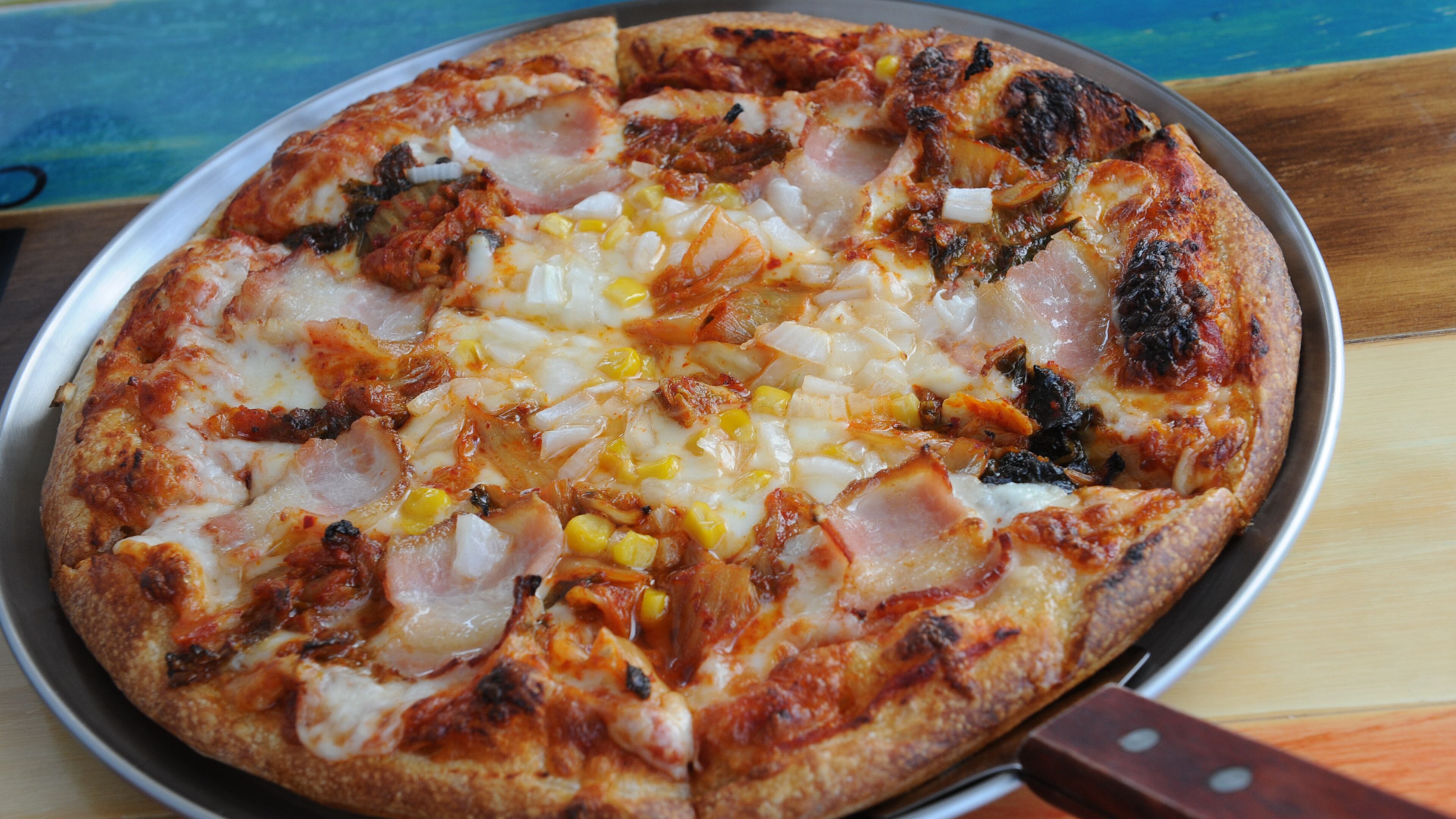 160713- SUWANEE- GA- Ligaya Figueras restaurant review of BonBon in Gwinnett. FOOD: Kimchee Pizza- applewood smoked bacon, kimchee, garlic, corn, onions and mozzarella. (BECKY STEIN PHOTOGRAPHY)