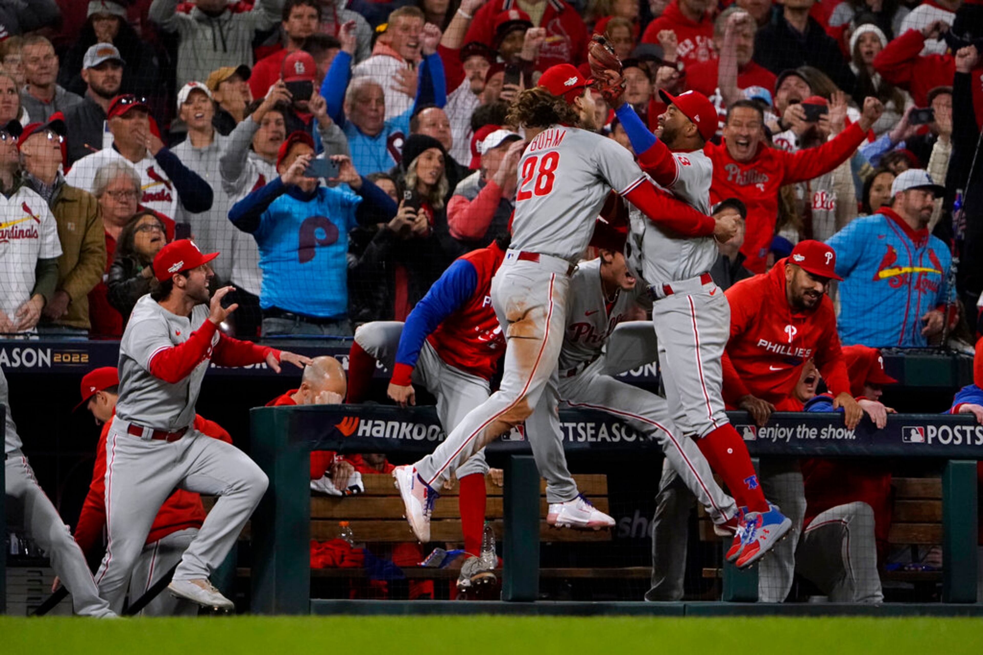 The Philadelphia Phillies celebrate after defeating the St. Louis Cardinals 2-0 in Game 2 of an NL wild-card baseball playoff series Saturday, Oct. 8, 2022, in St. Louis. The Phillies advanced to the NL Division Series against the Atlanta Braves. (AP Photo/Jeff Roberson)