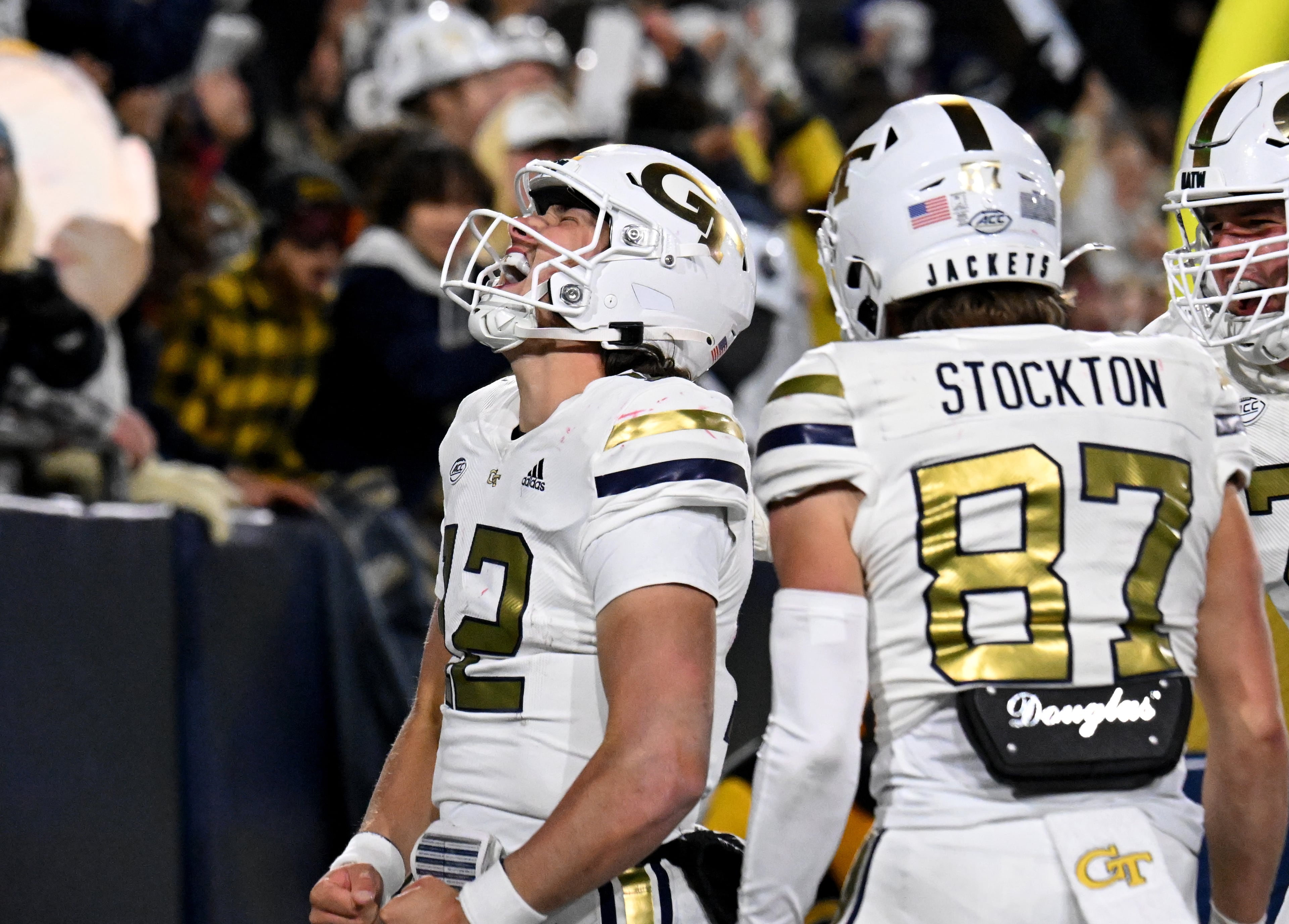 Georgia Tech quarterback Aaron Philo (12) celebrates with teammates after scoring during the fourth quarter. (Hyosub Shin / AJC)