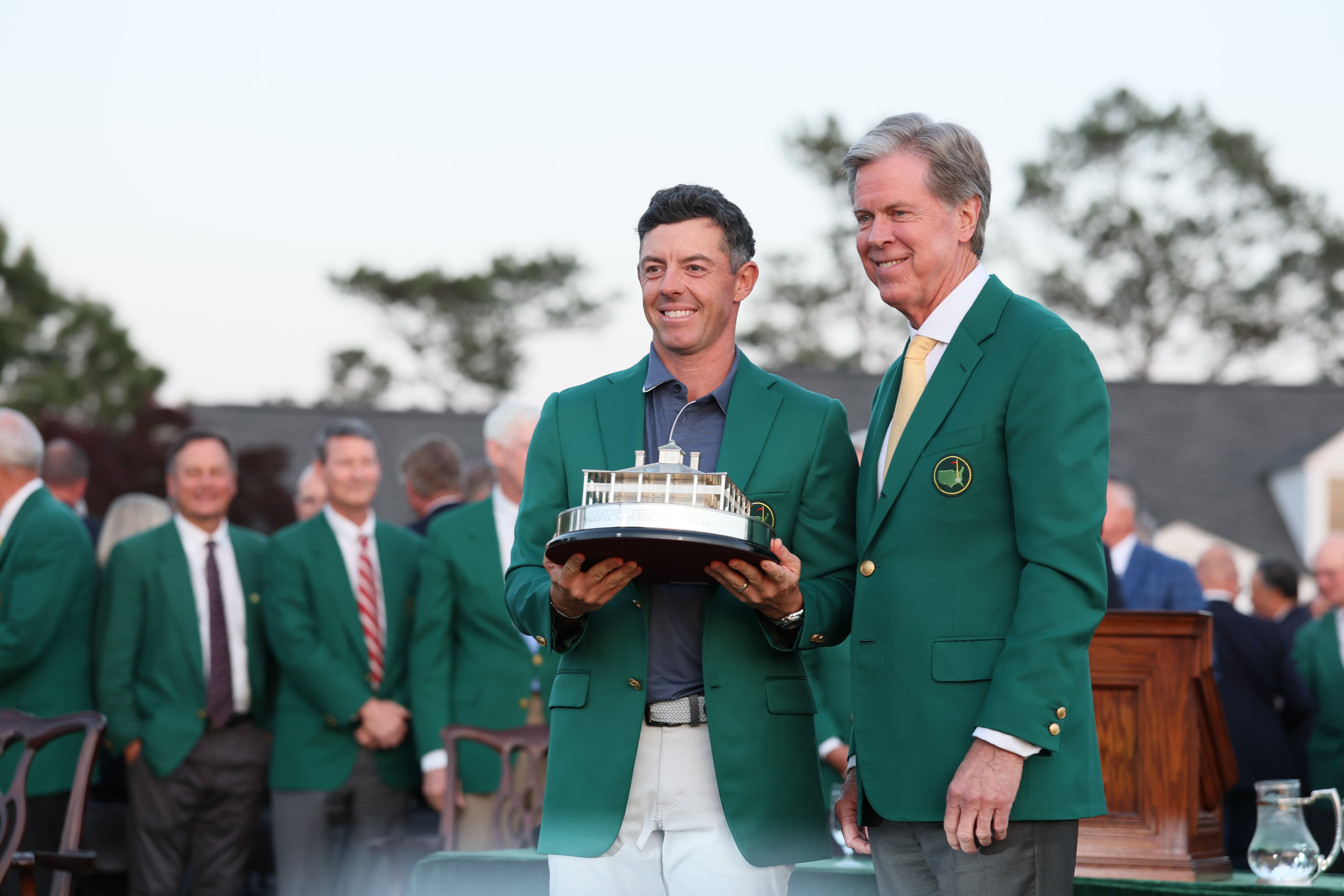 Rory McIlroy celebrates winning the Masters golf tournament with Fred Ridley, chairman of Augusta National Golf Club at Augusta National Golf Club, Sunday, April 13, 2025, in Augusta, Ga. (Hyosub Shin / AJC)
