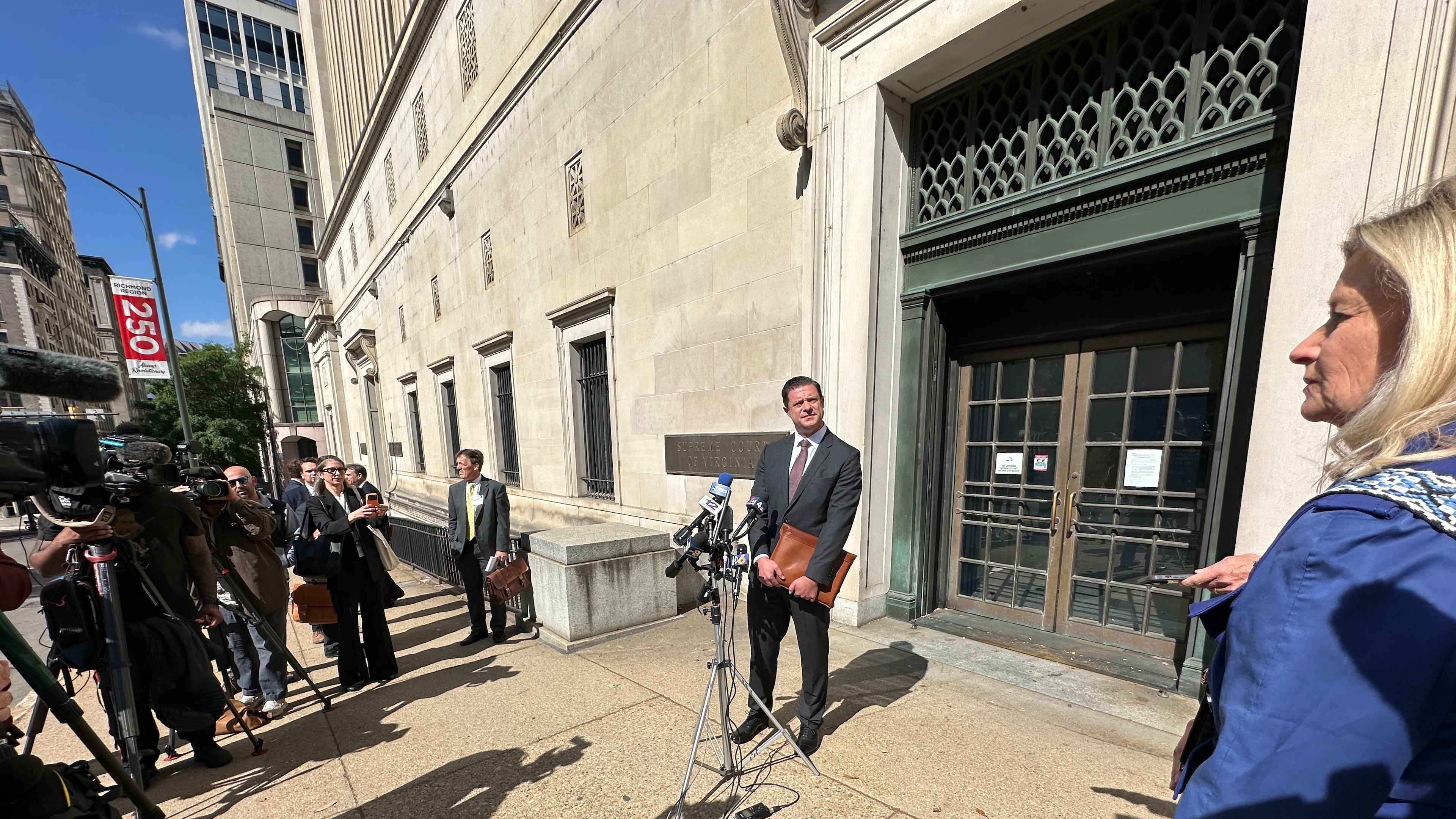 Attorney Matthew Seligman, representing Democratic state legislators, speaks with the media following a hearing on new congressional maps before the state Supreme Court in Richmond, Va., on Monday, April 27, 2026. (AP Photo/Allen G. Breed)
