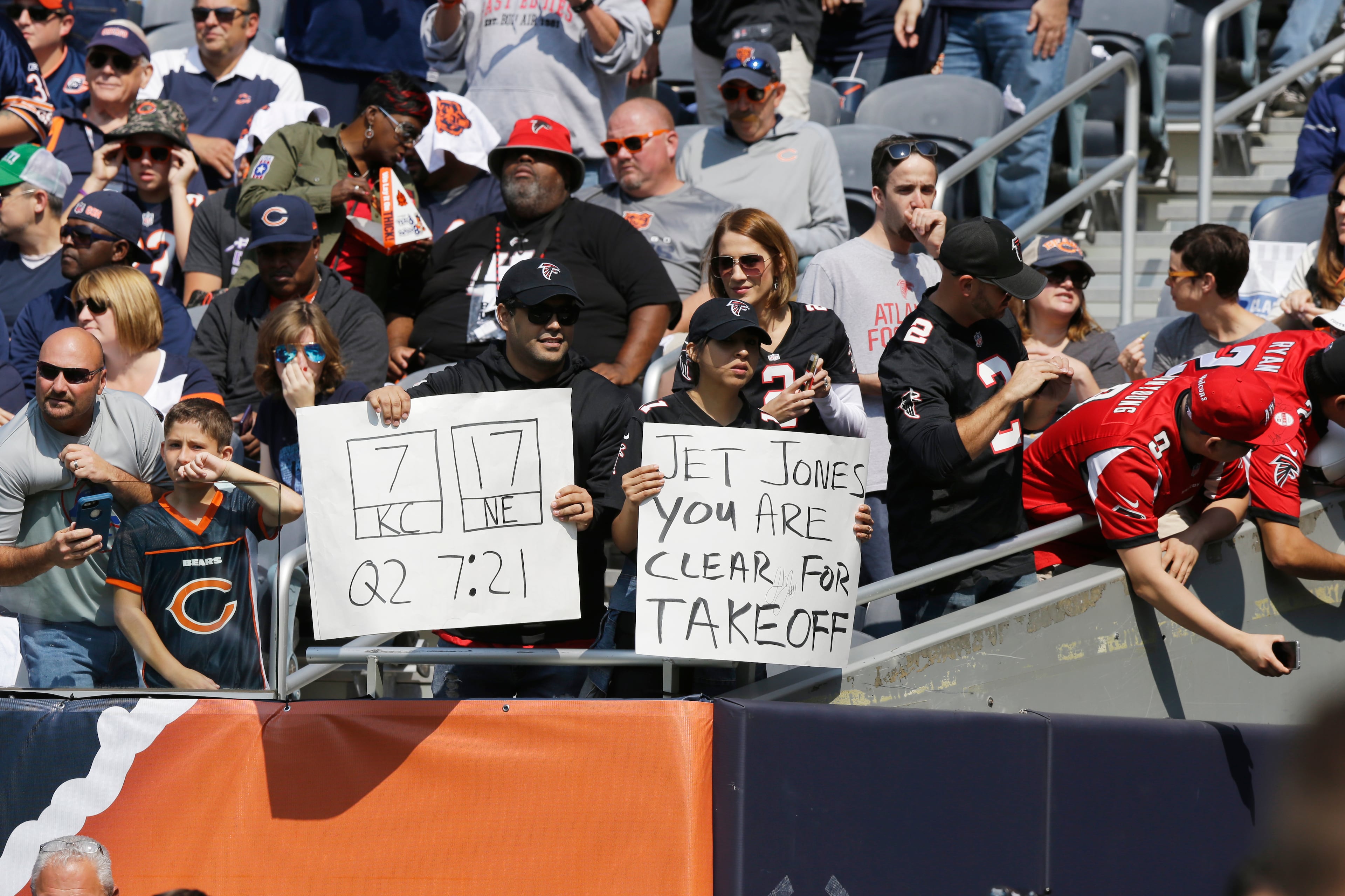 Fans hold signs during the first half of an NFL football game between the Chicago Bears and the Atlanta Falcons, Sunday, Sept. 10, 2017, in Chicago. (AP Photo/Michael Conroy)