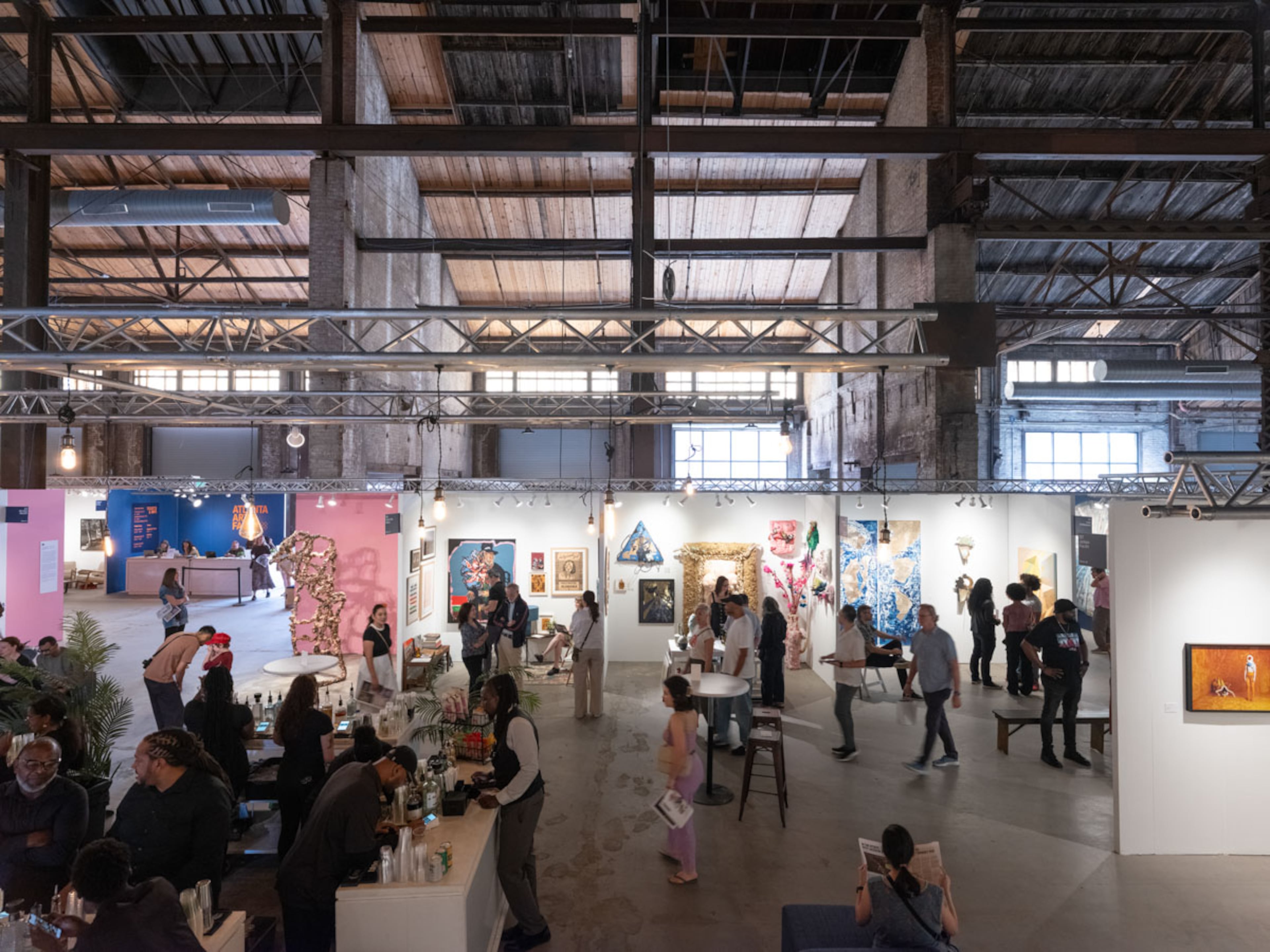 Gallery booths line Pullman Yards’ industrial space during the 2025 Atlanta Art Fair. (Courtesy of Atlanta Art Fair/Walker Bankson)
