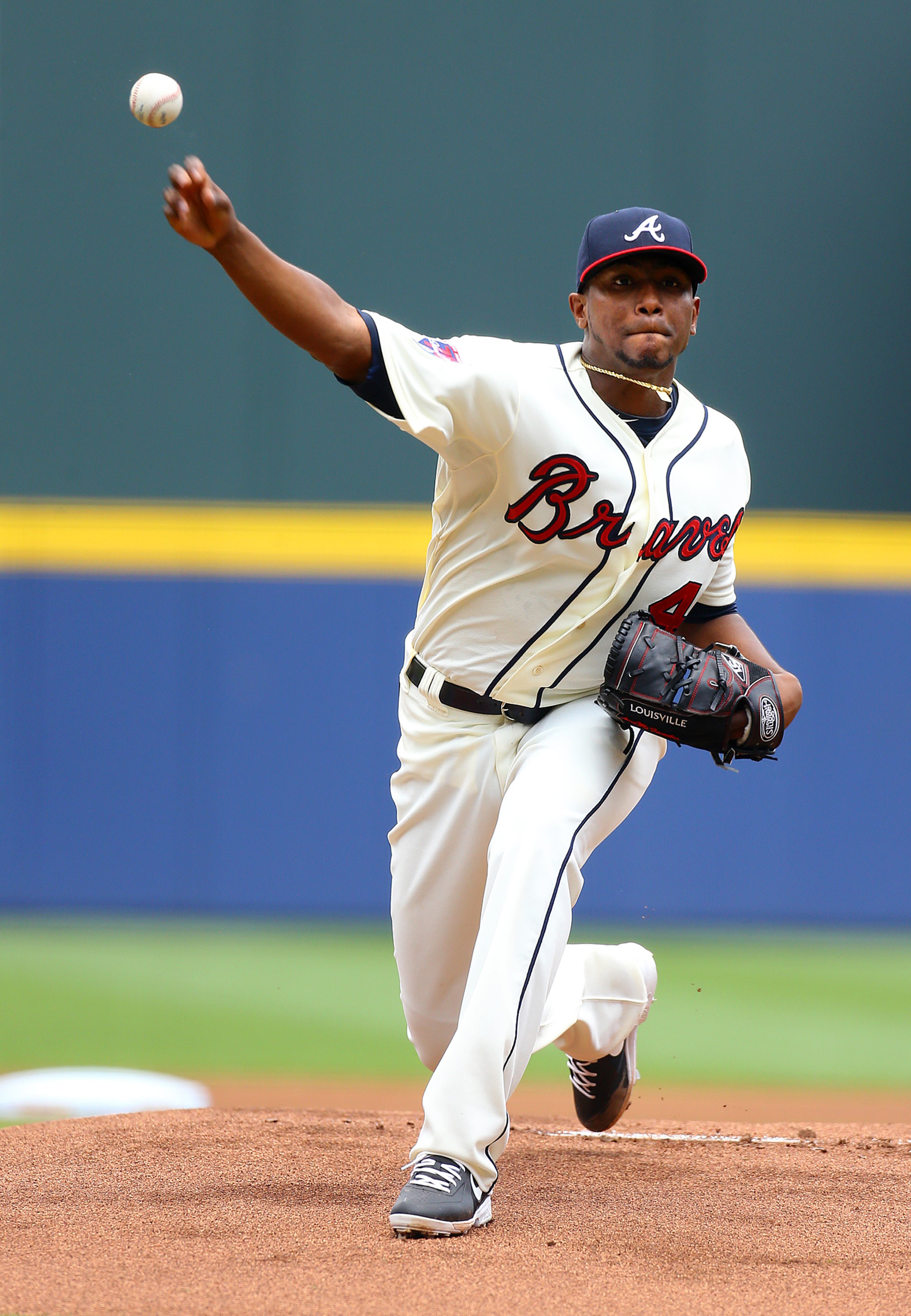 Braves pitcher Julio Teheran, making his sixth start of the season and the 40th start of his career, delivers a pitch against the Reds during the first inning of a MLB baseball game on Sunday, April 27, 2014, in Atlanta. CURTIS COMPTON / CCOMPTON@AJC.COM