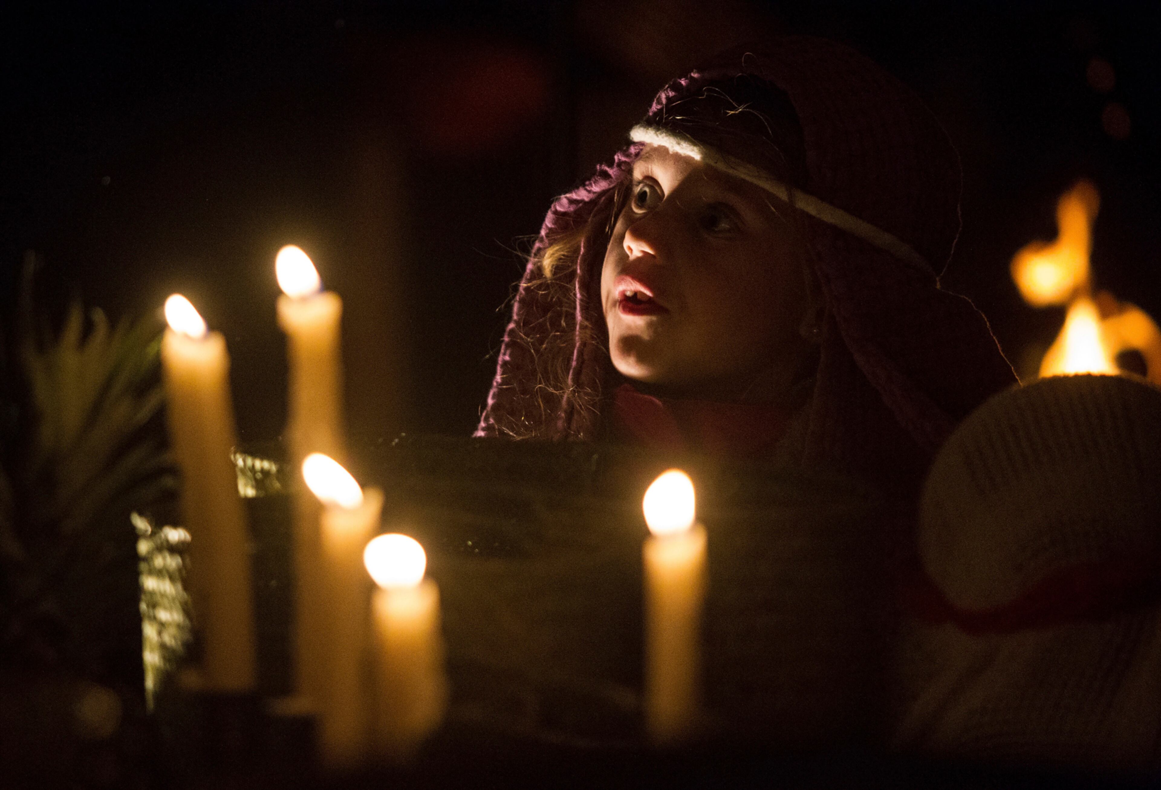 Dressed as a peasant, Katie Thompson, 6, looks around her as a live nativity scene unfolds Monday, Dec. 19, 2016, in Twin Falls, Idaho. (Drew Nash/The Times-News via AP)