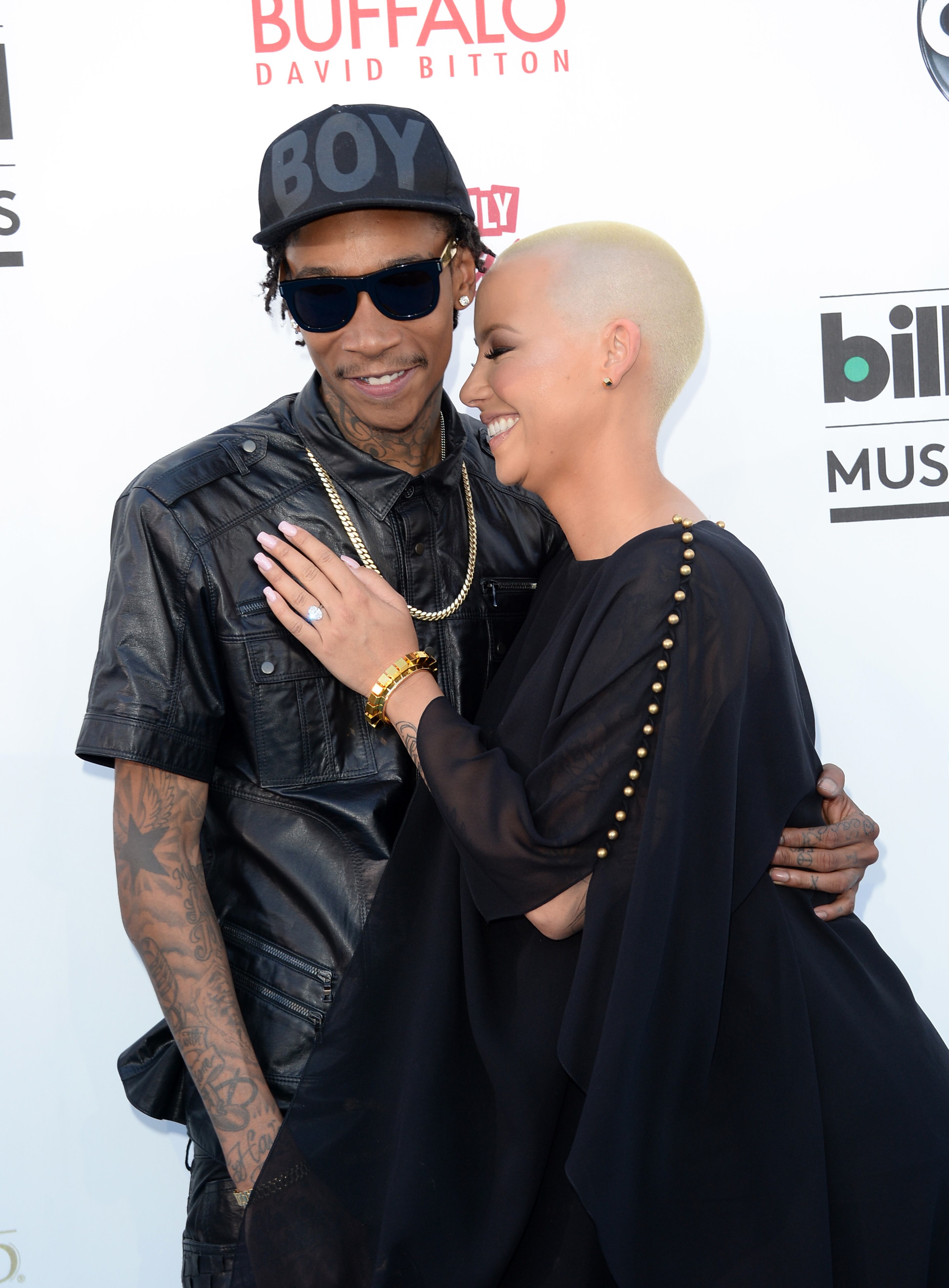 LAS VEGAS, NV - MAY 19: Wiz Khalifa (L) and Amber Rose arrive at the 2013 Billboard Music Awards at the MGM Grand Garden Arena on May 19, 2013 in Las Vegas, Nevada. (Photo by Jason Merritt/Getty Images)