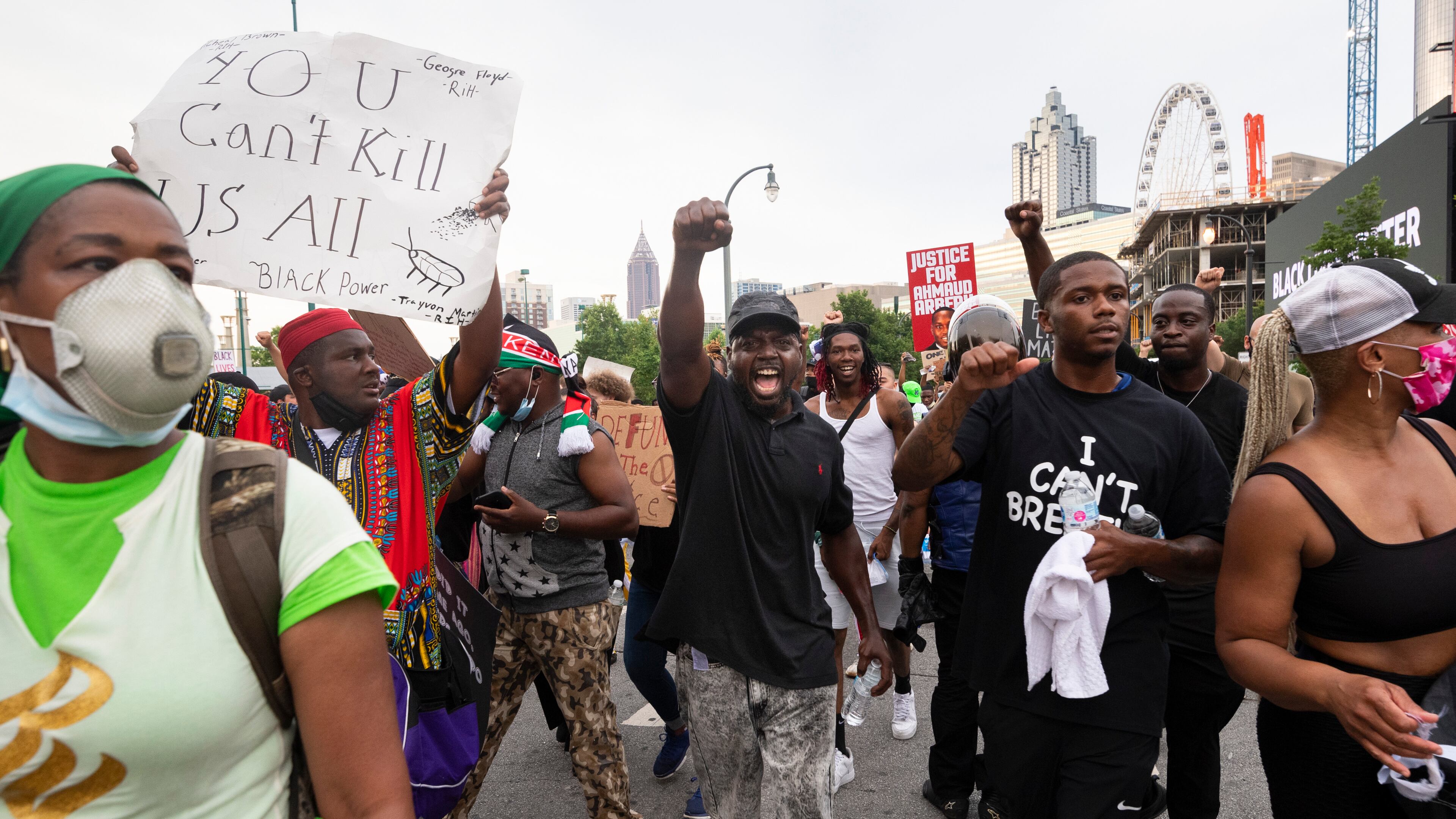 A man shouts as he marches on Centennial Olympic Park Drive during Saturday’s protests in downtown Atlanta.