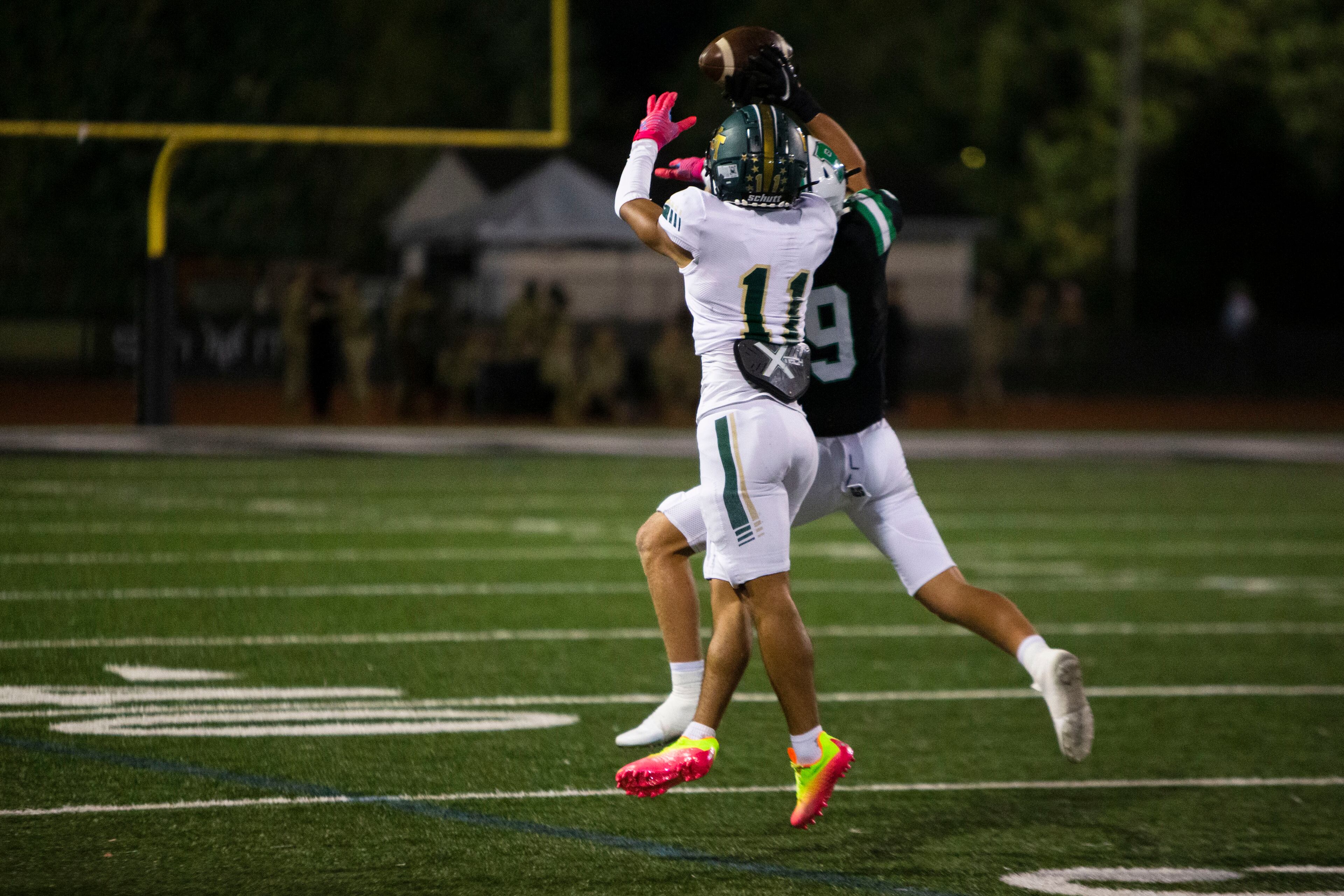 Hill Plunkett, corner back for Roswell, intercepts the ball from Zyon Mckenzie, wide receiver for Blessed Trinity, during the Blessed Trinity vs. Roswell high school football game on Thursday, September 29, 2022, at Roswell high school in Roswell, Georgia. Roswell led Blessed Trinity 34-0 at the end of the third quarter. CHRISTINA MATACOTTA FOR THE ATLANTA JOURNAL-CONSTITUTION.
