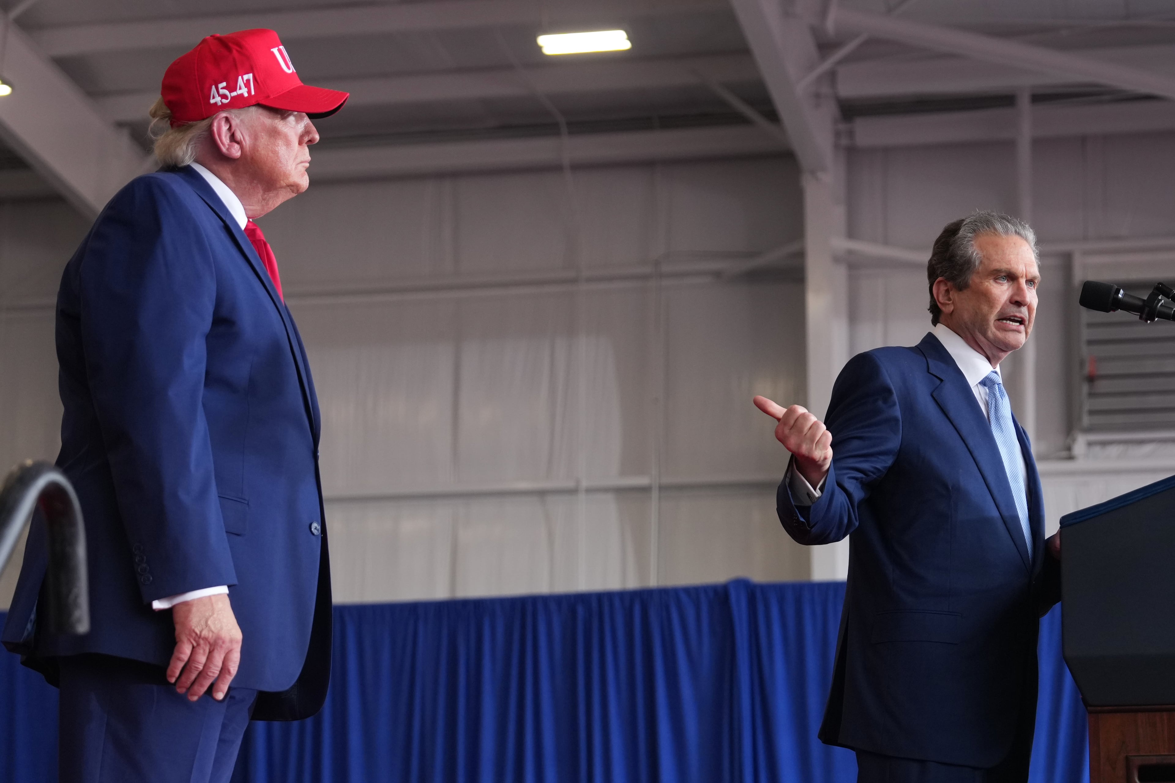 President Donald Trump listens as Georgia gubernatorial candidate Rick Jackson speaks at a campaign rally at Dalton Municipal Airport, Friday, Oct. 16, 2026, in Dalton, Ga. (Mark Schiefelbein/AP)