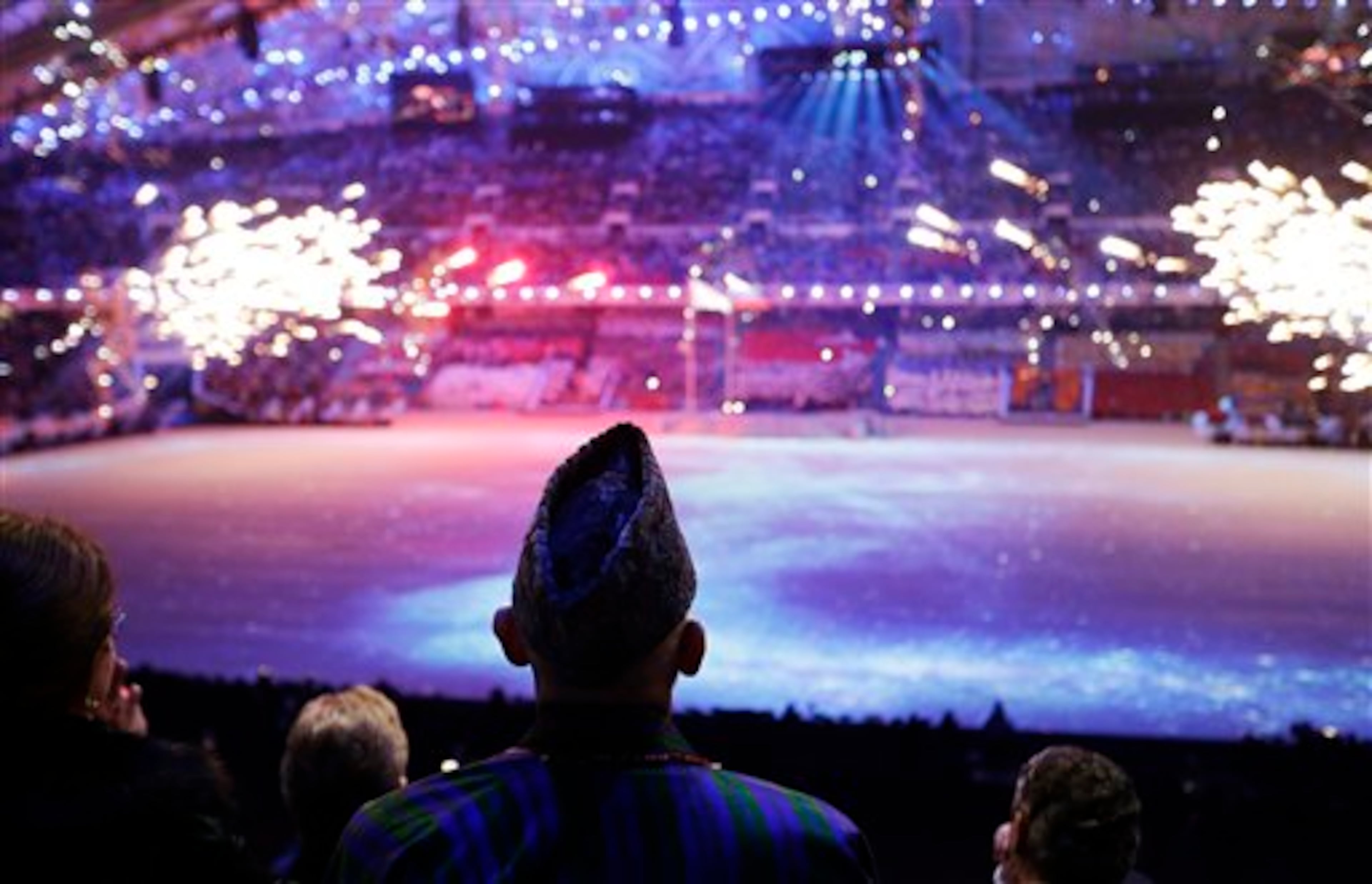 Afghan President Hamid Karzai watches fireworks during the opening ceremony of the 2014 Winter Olympics, Friday, Feb. 7, 2014, in Sochi, Russia. (AP Photo/David Goldman, Pool)