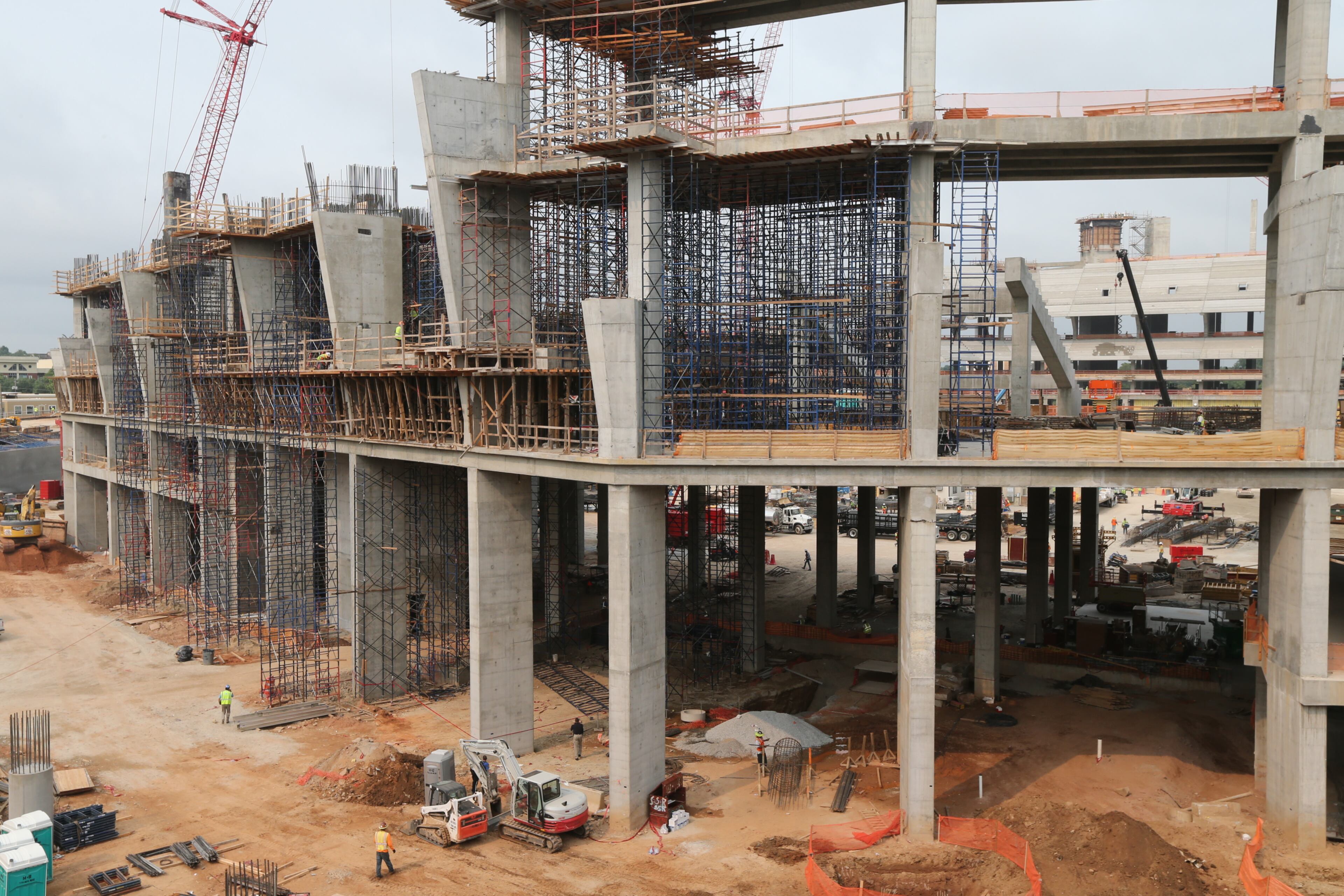 A man was being treated Wednesday morning for a “severe head injury” after metal scaffolding fell on him near the construction site for the new Atlanta Falcons stadium, officials said.