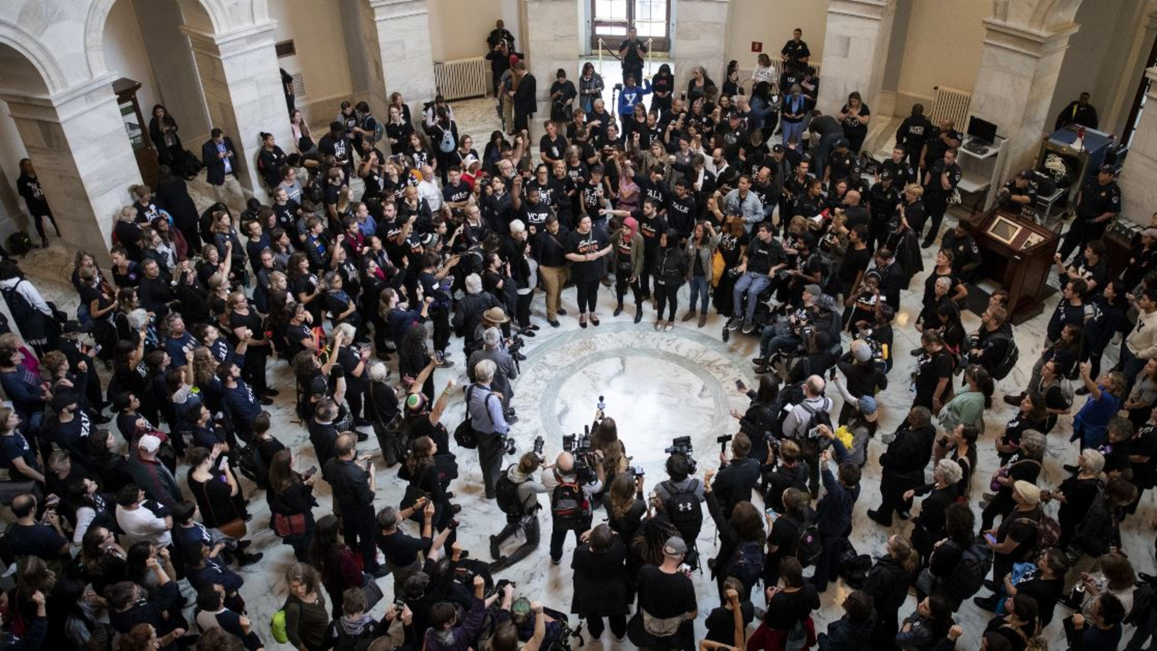 Protestors rally against Supreme Court nominee Judge Brett Kavanaugh in the rotunda of the Russell Senate Office Building on Capitol Hill in Washington on Monday. Christine Blasey Ford, who has accused Kavanaugh of sexual assault, has agreed to testify before the Senate Judiciary Committee on Thursday. Drew Angerer/Getty Images