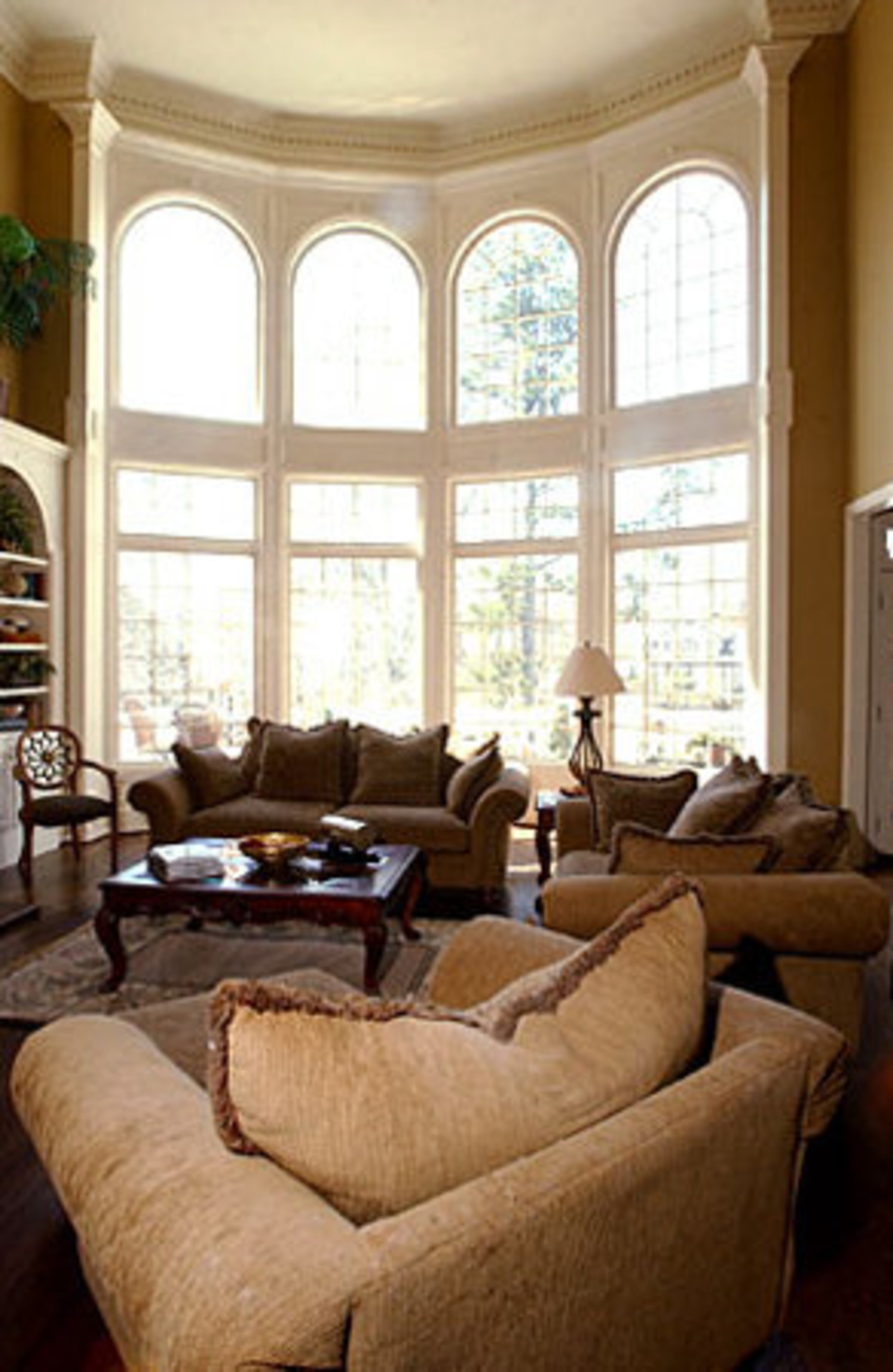 Those arched windows overlook a spacious deck. The home includes views of the eighth fairway and ninth tee of Sugarloaf's championship golf course. "As enormous as it is, it's quite cozy. She's got it decorated so nicely," Bacon said. "There's plenty of warmth in this thing. You can't get lost in it, or cold."