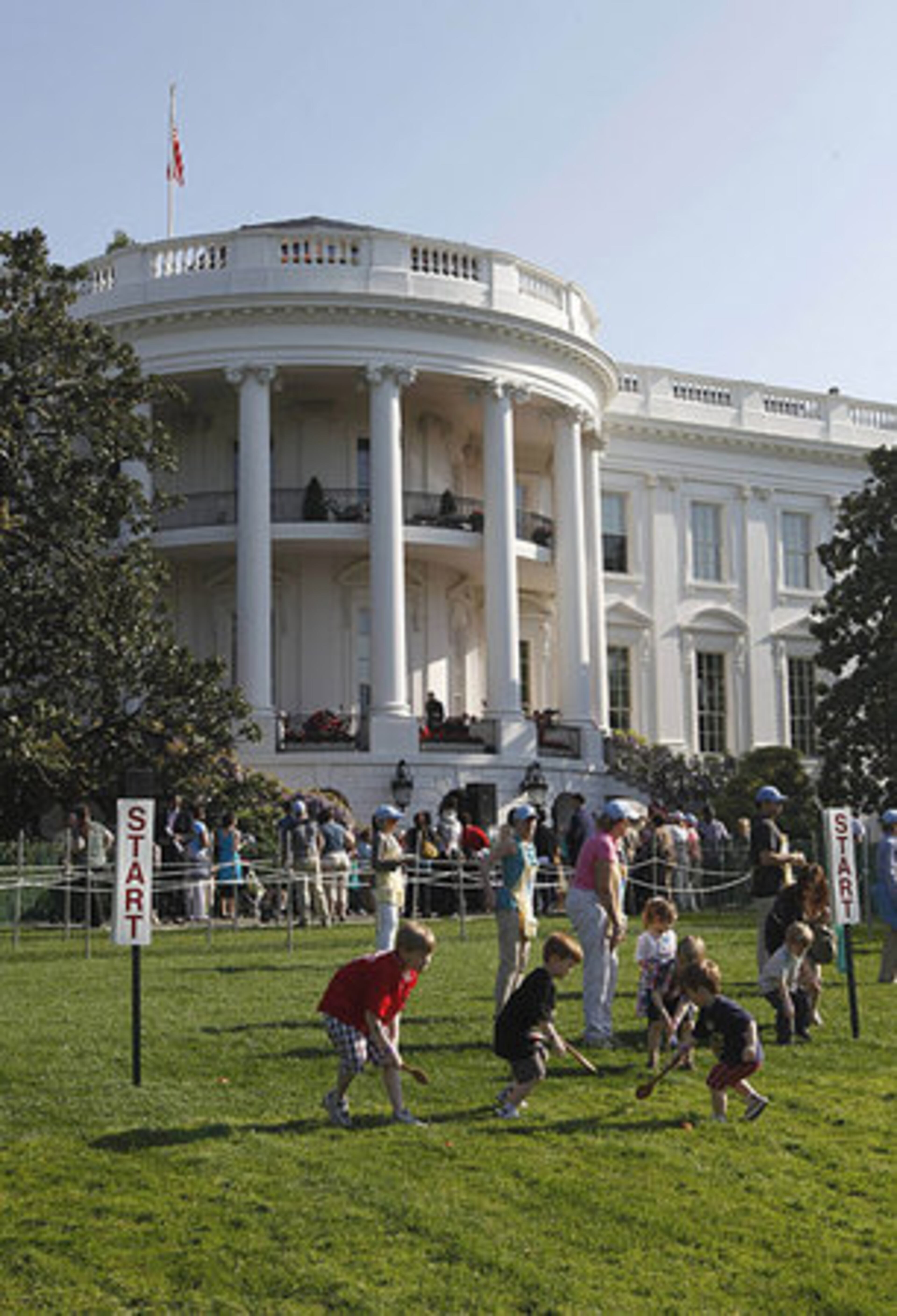 Children roll eggs on the South Lawn of the White House in Washington, Monday, April 25, 2011, during the 2011 White House Easter Egg Roll.