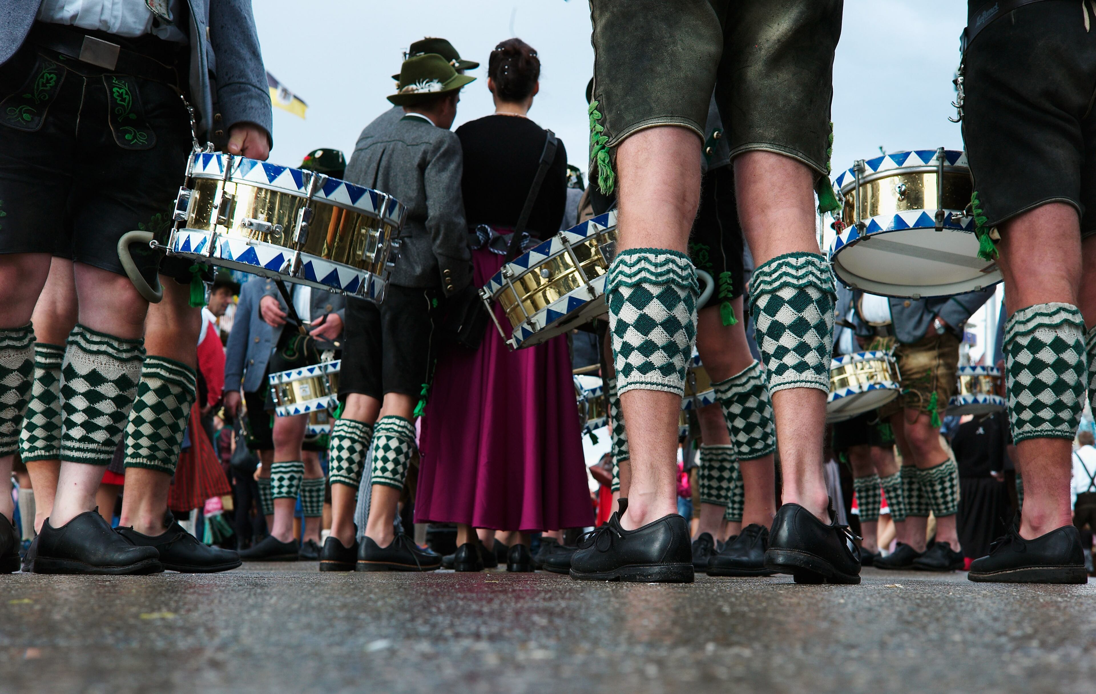 MUNICH, GERMANY - SEPTEMBER 21: Participants of the Parade of Costumes and Riflemen (Trachten- und Schuetzenzug) wearing 'Wadlstruempfe' traditional Bavarian stockings gather together on the second day of the 2014 Oktoberfest on September 21, 2014 in Munich, Germany. The 181st Oktoberfest will be open to the public from September 20 through October 5 and traditionally draws millions of visitors from across the globe in the world's largest beer fest. (Photo by Johannes Simon/Getty Images)