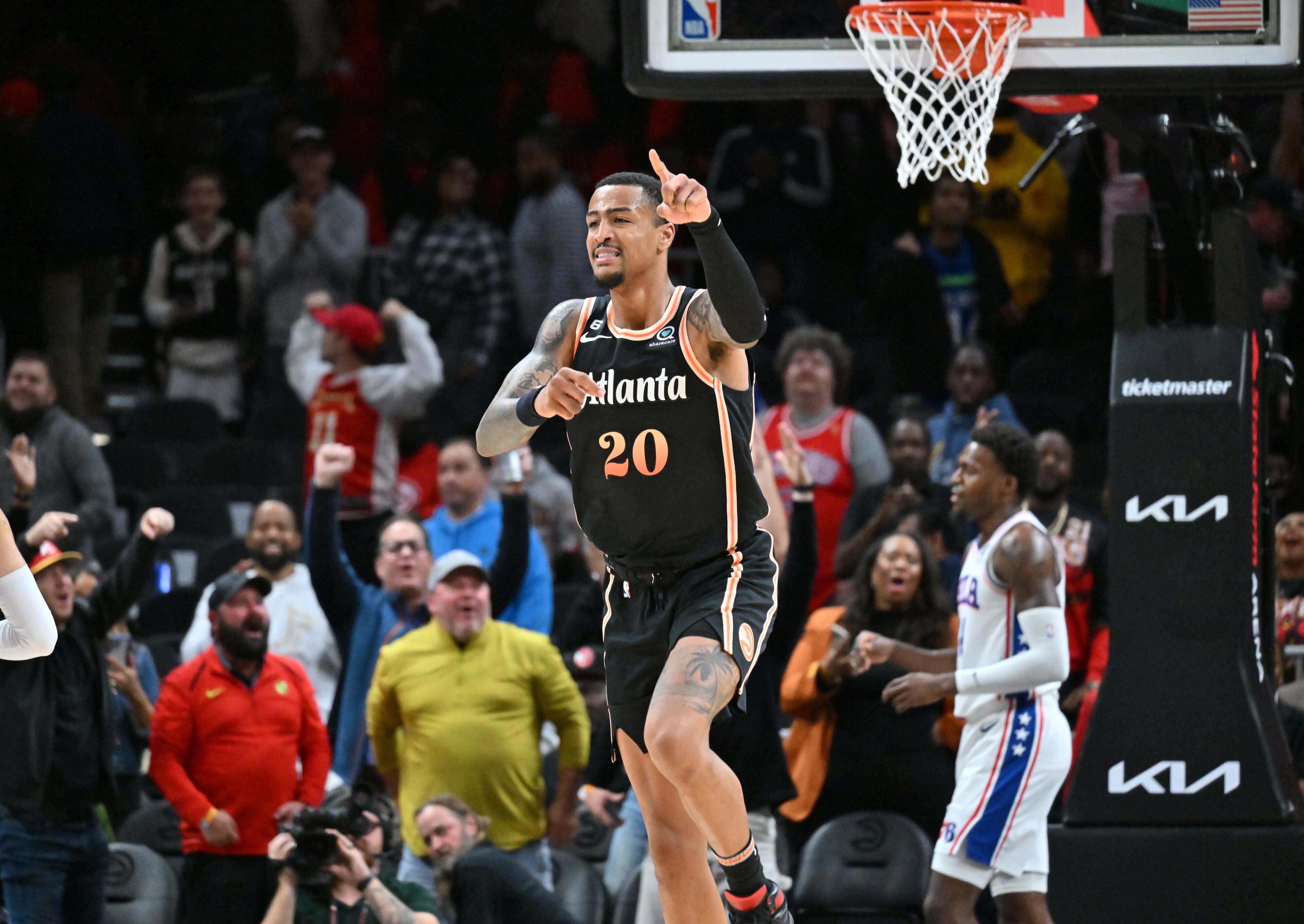 Hawks' forward John Collins (20) celebrates after dunking the ball during the second half. (Hyosub Shin / Hyosub.Shin@ajc.com)