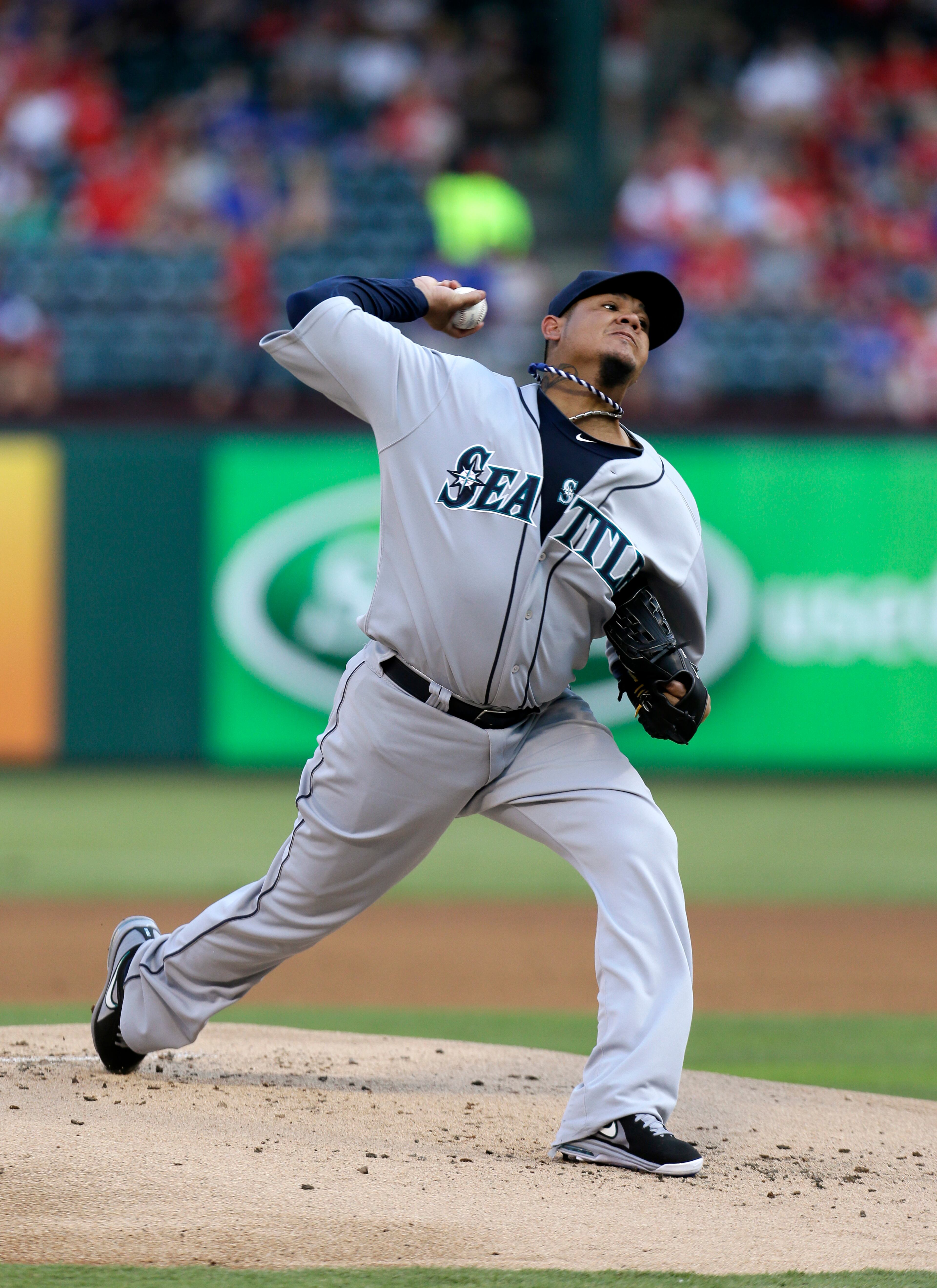 Seattle Mariners starting pitcher Felix Hernandez (34) works against the Texas Rangers in the first inning of a baseball game Wednesday, July 3, 2013, in Arlington, Texas. (AP Photo/Tony Gutierrez)