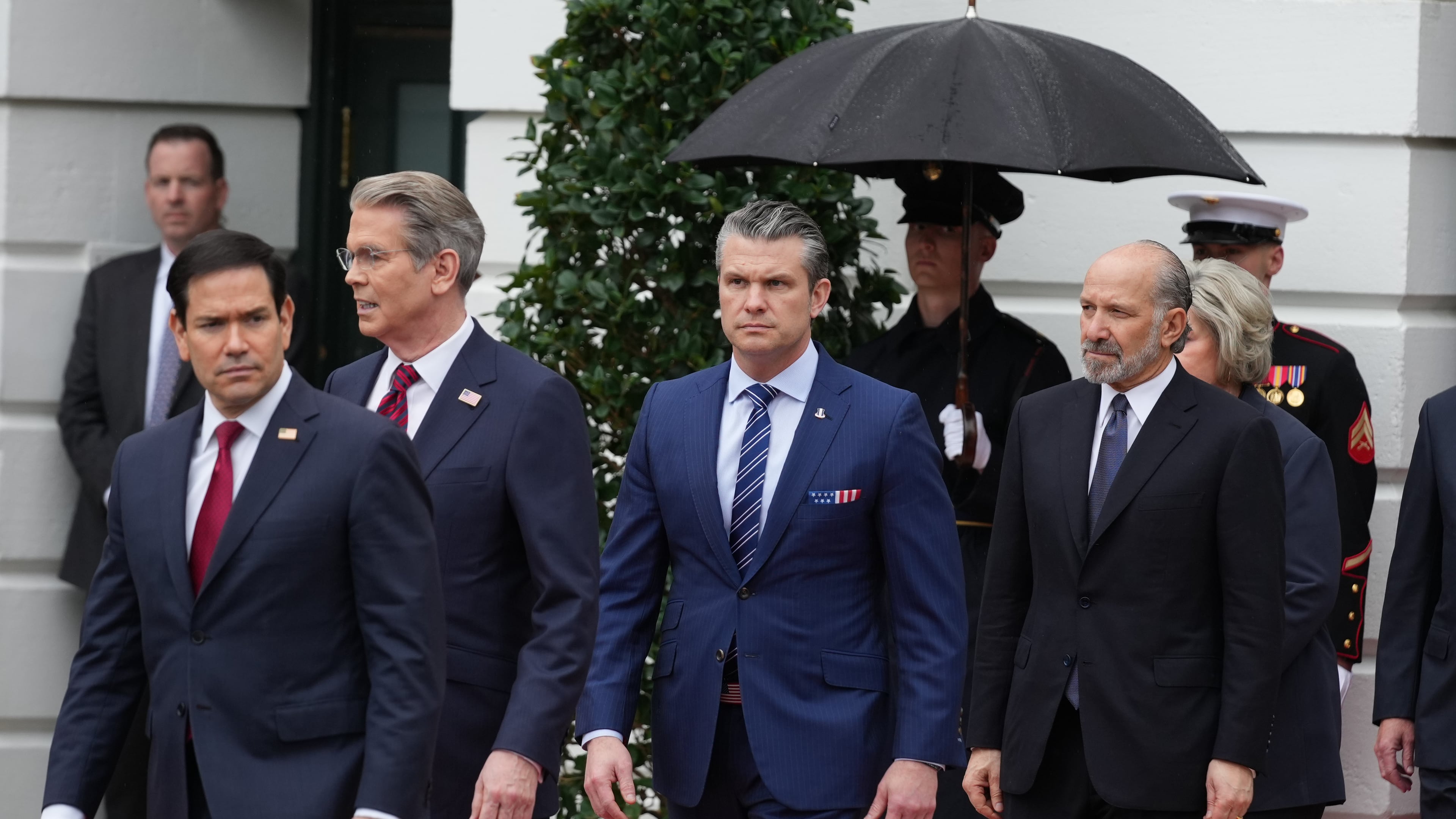 From left, Secretary of State, Marco Rubio, Treasury Secretary Scott Bessent, Secretary of Defense Pete Hegseth and Commerce Secretary Howard Lutnick, arrive before President Donald Trump and first lady Melania Trump greet Britain's King Charles III and Queen Camilla during a State Visit arrival ceremony on the South Lawn of the White House, Tuesday, April 28, 2026, in Washington. (AP Photo/Mark Schiefelbein)