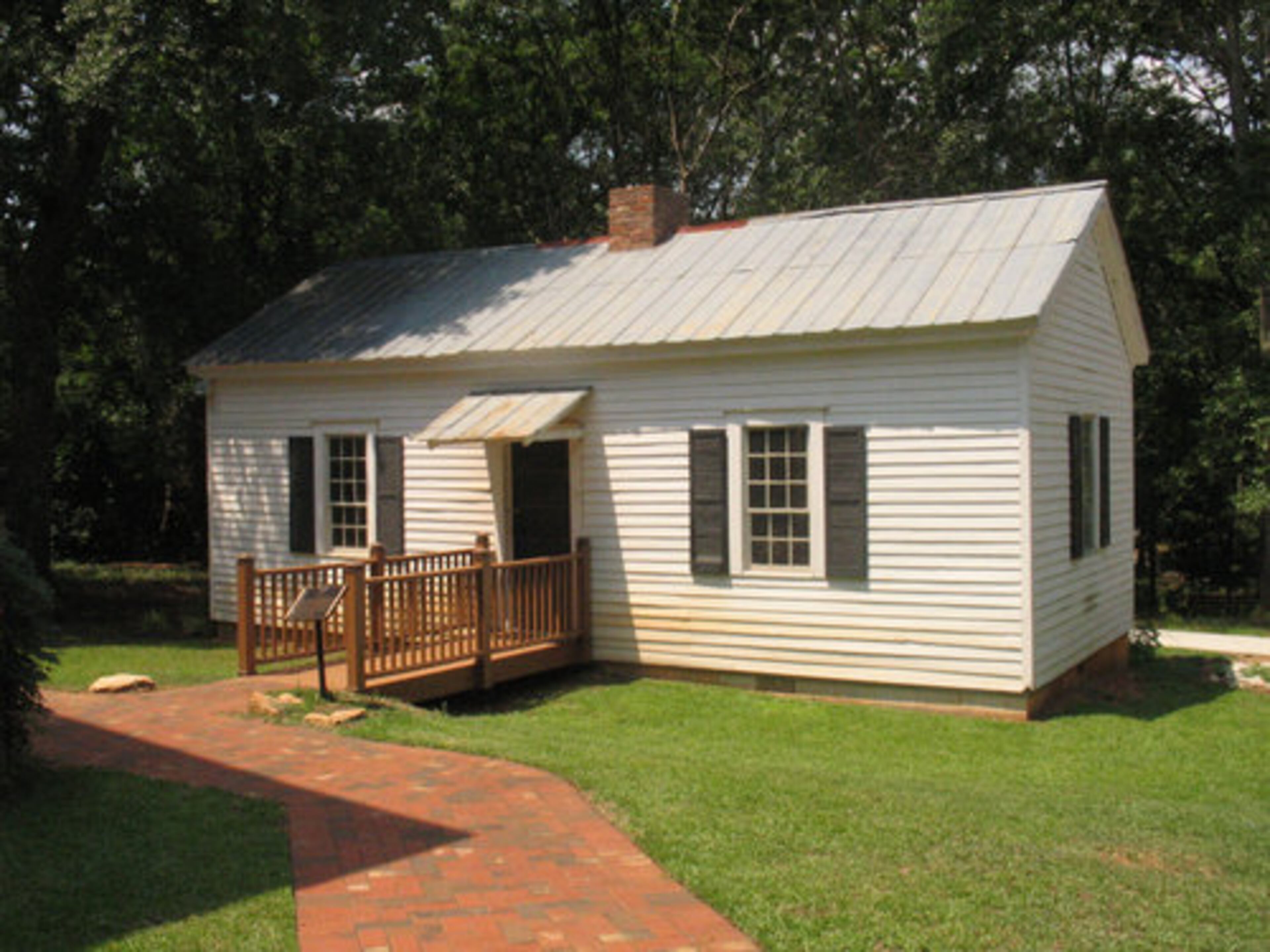 KITTY'S COTTAGE was the home of Kitty Andrew Shell, a slave owned by Bishop James O. Andrew. Though she was freed and given permission to emigrate to Liberia, Kitty chose to live in the cottage on Andrew's property.