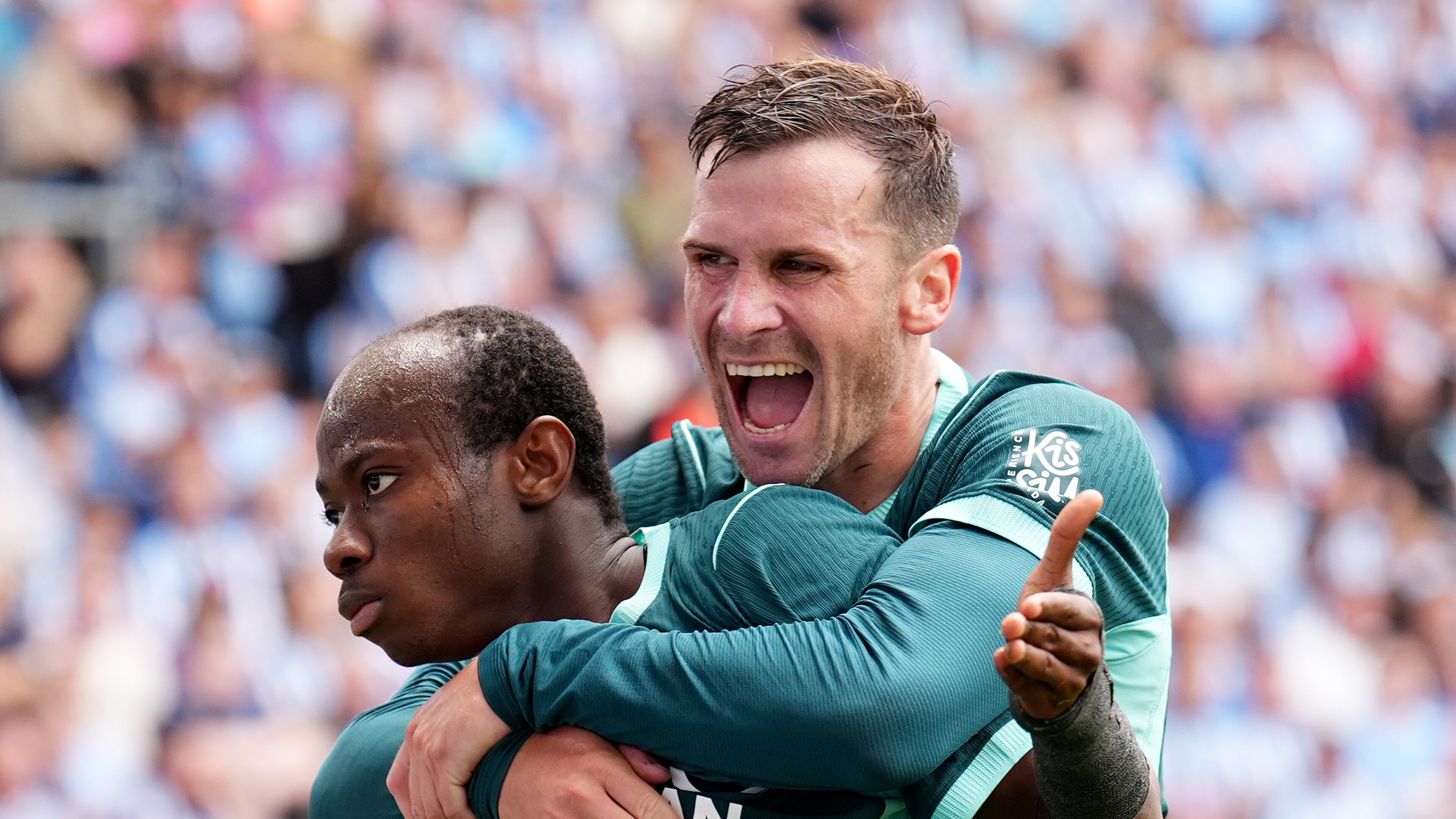 Brighton and Hove Albion's Malick Yalcouye, left, celebrates with Pascal Gross after scoring their side's second goal of the game during the English Premier League soccer match between Coventry City and Brighton and Hove Albion in Coventry, England, Sunday Sept. 13, 2026. (Mike Egerton/PA via AP)