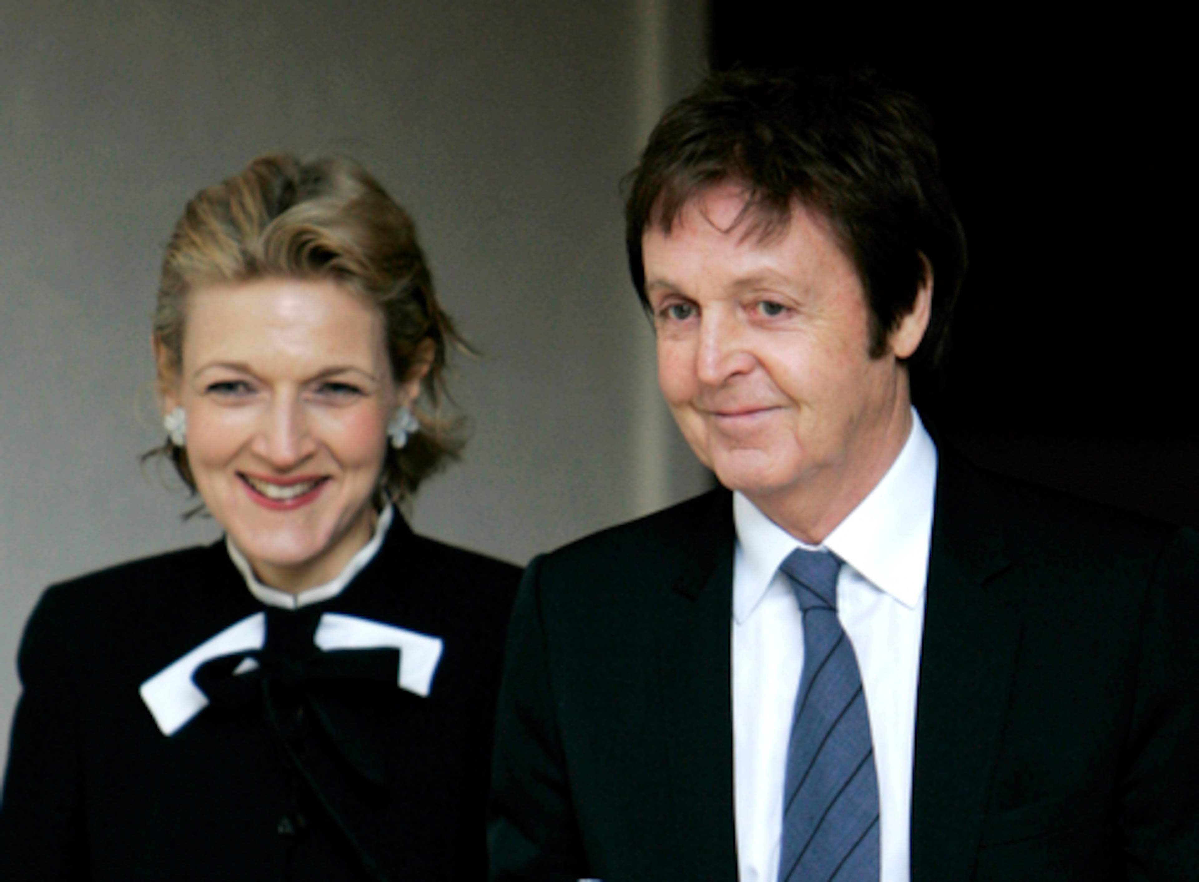 Sir Paul McCartney leaves the central London's Royal Courts of Justice with his divorce lawyer Fiona Shackleton. The former Beatle is a bachelor again. With assets totaling about $800 million.