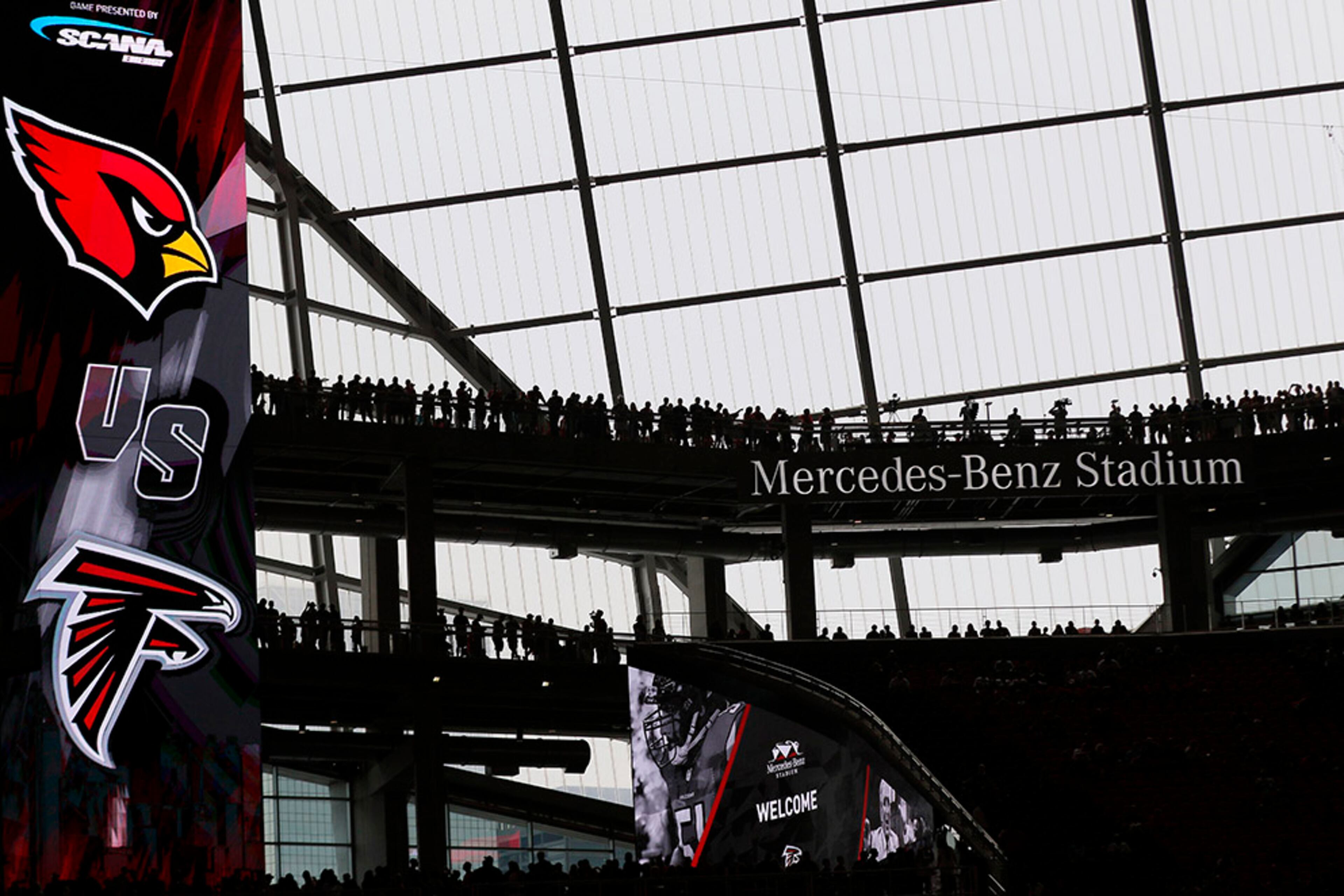 Fans take their first look at the field before the first game at Mercedes-Benz Stadium Saturday, Aug. 26, 2017. The Falcons opened their new stadium during an exhibition game against the Arizona Cardinals in Atlanta.