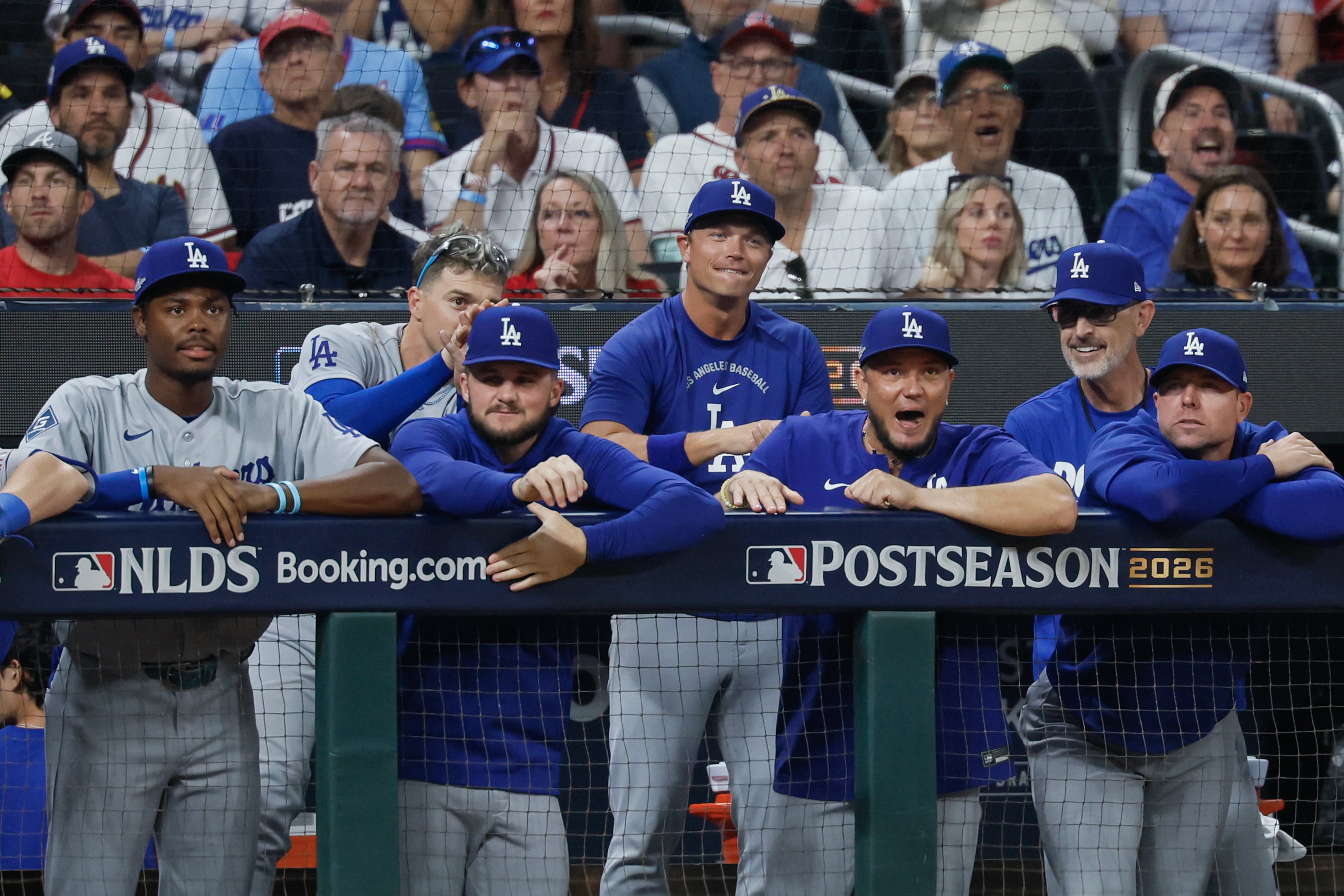 The Los Angeles Dodgers dugout reacts after scoring two runs against the Atlanta Braves during the seventh inning of Game 4 of the MLB National League Division Series between the Atlanta Braves and the Los Angeles Dodgers, Wednesday, Oct. 7, 2026, in Atlanta. (Miguel Martinez/AJC)