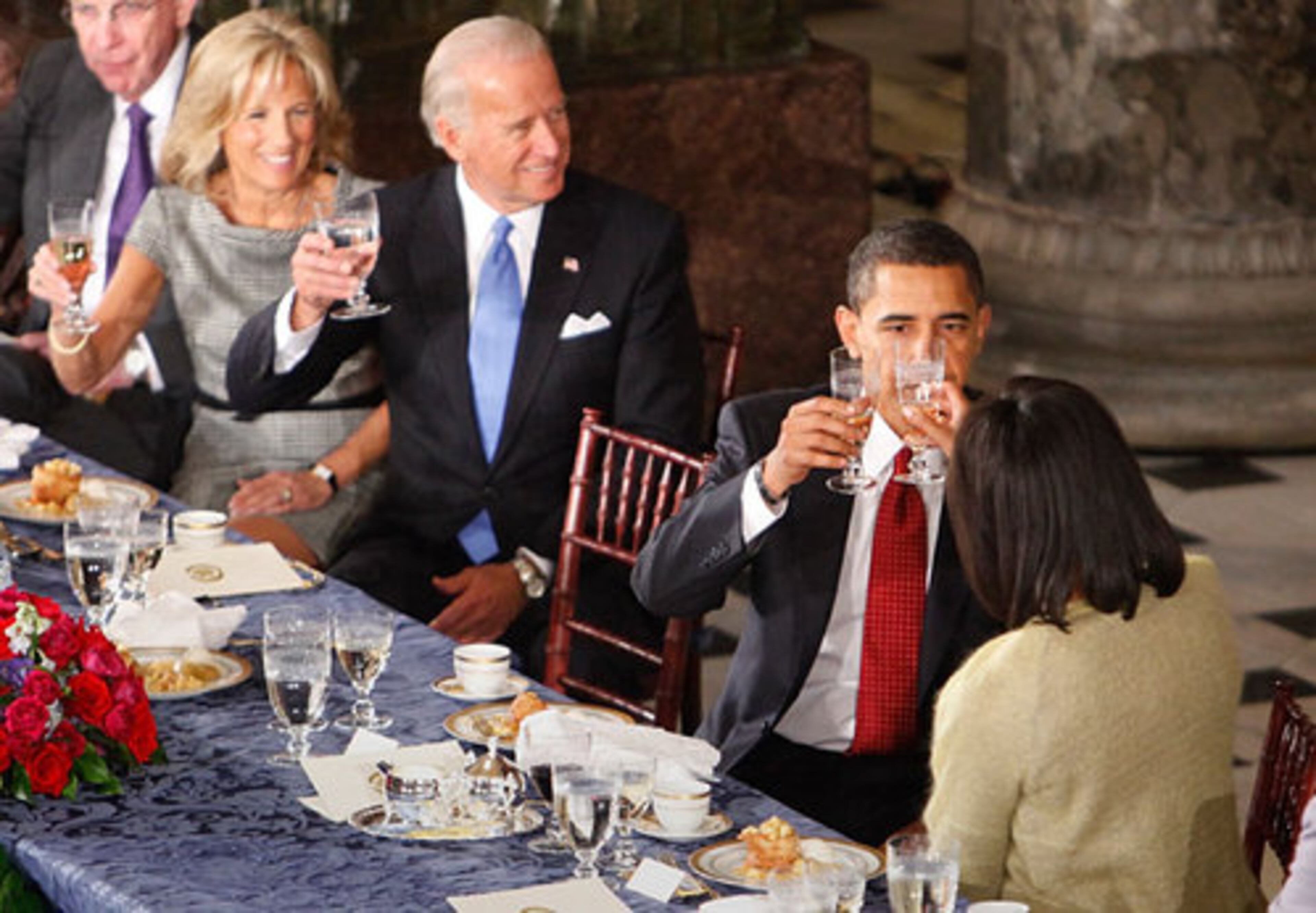 Obama raises his glass for a toast with wife Michelle alongside Vice President Joe Biden and his wife, Jill, at the end of their lunch at Statuary Hall in the U.S. Capitol.