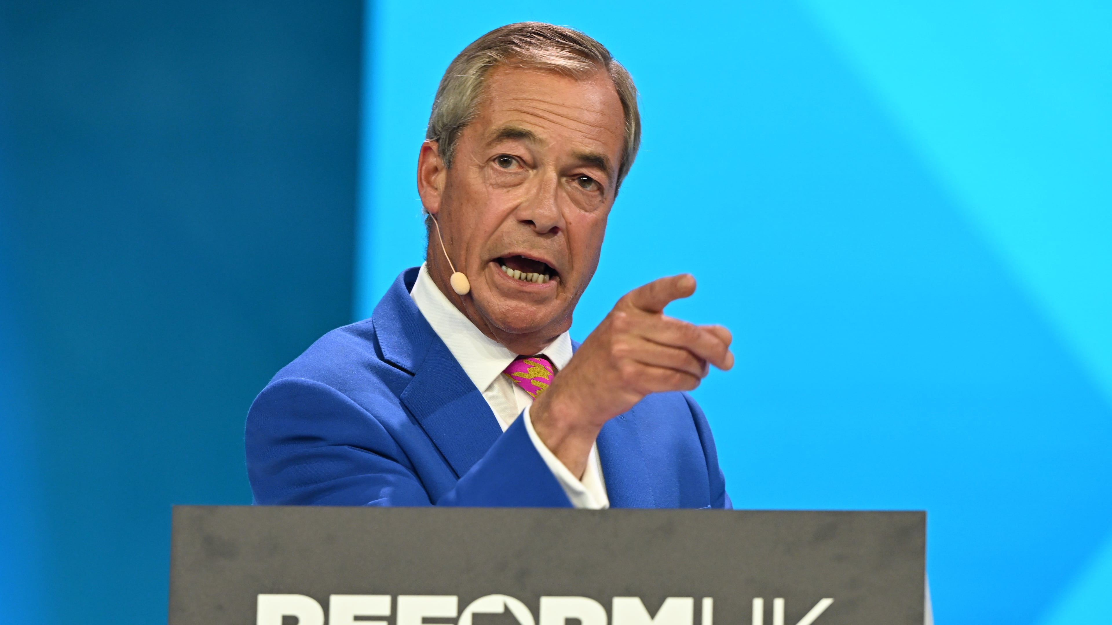 Reform Party Leader Nigel Farage points as he speaks during the Reform party's annual conference at the National Exhibition Centre in Birmingham, England, Friday, Sept. 4, 2026. (AP Photo/Thomas Krych)