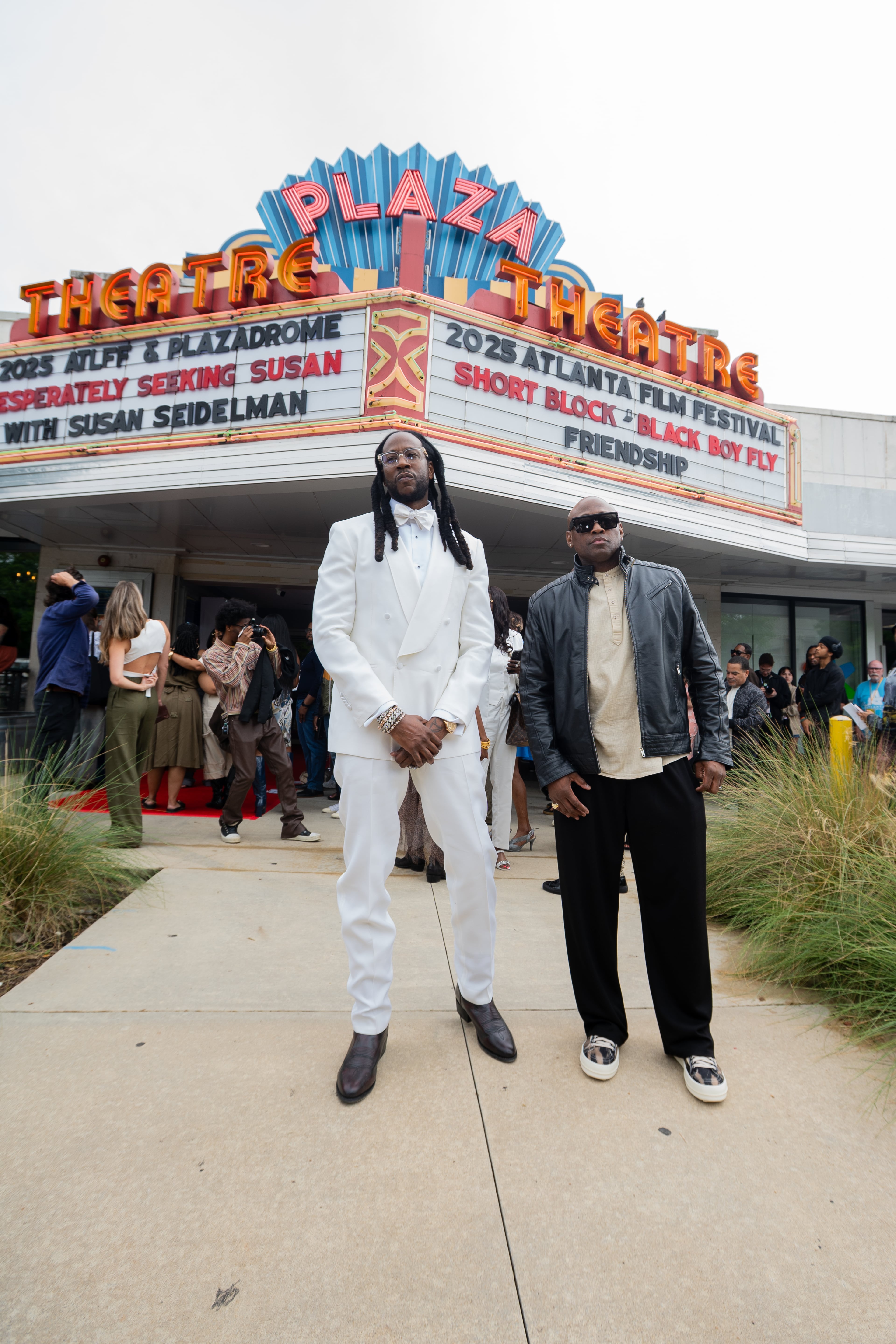 Rapper 2 Chainz (left) and actor Omar Epps in front of the Plaza Theatre in Atlanta on Saturday, May 3, 2025, before attending a screening of their co-produced short film "Red Clay" at the Atlanta Film Festival. (Courtesy of Shaddai Peña)