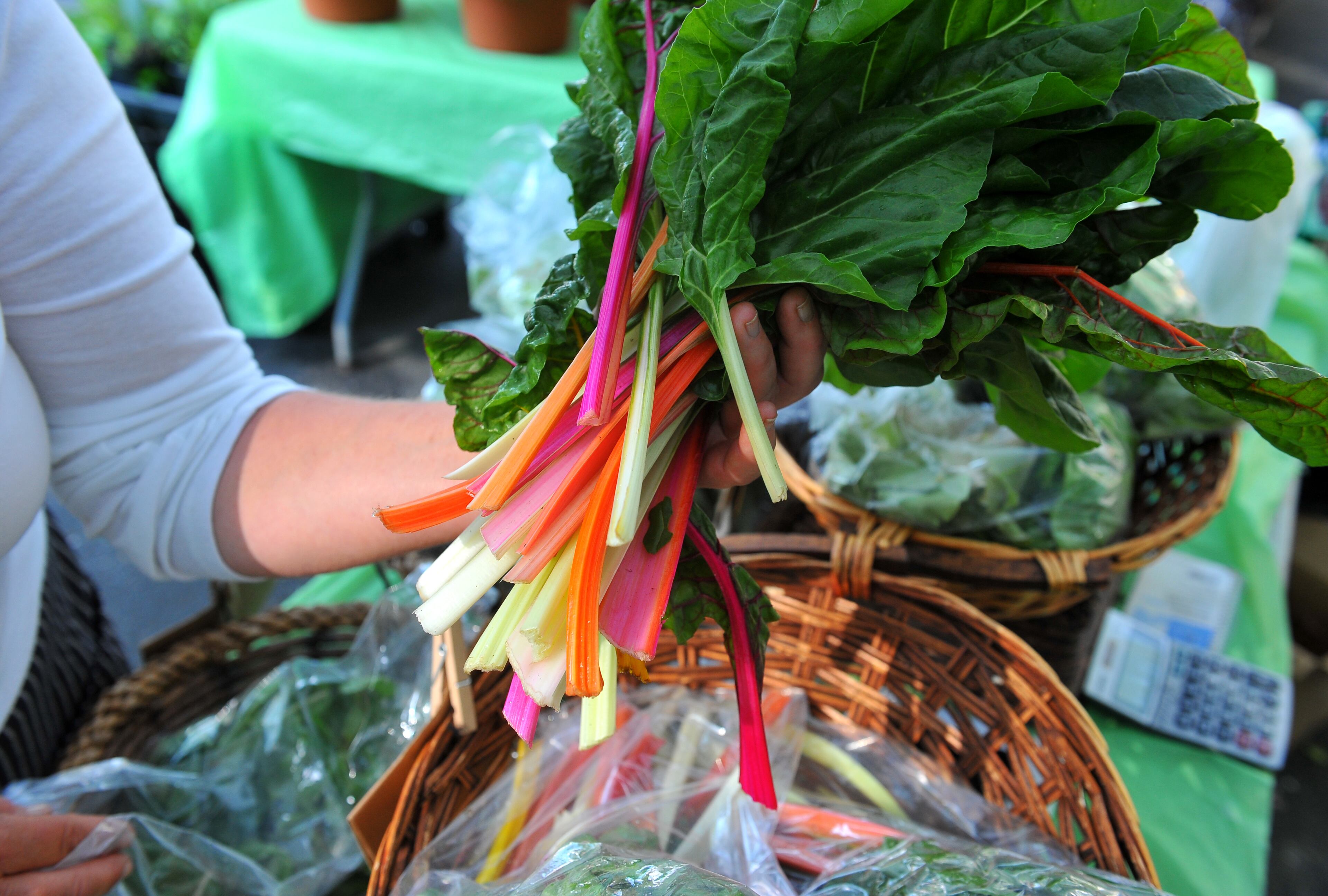 Paula Guilbeau of Heirloom Gardens sells a variety of produce at the Peachtree Road Farmers Market, including Swiss chard.